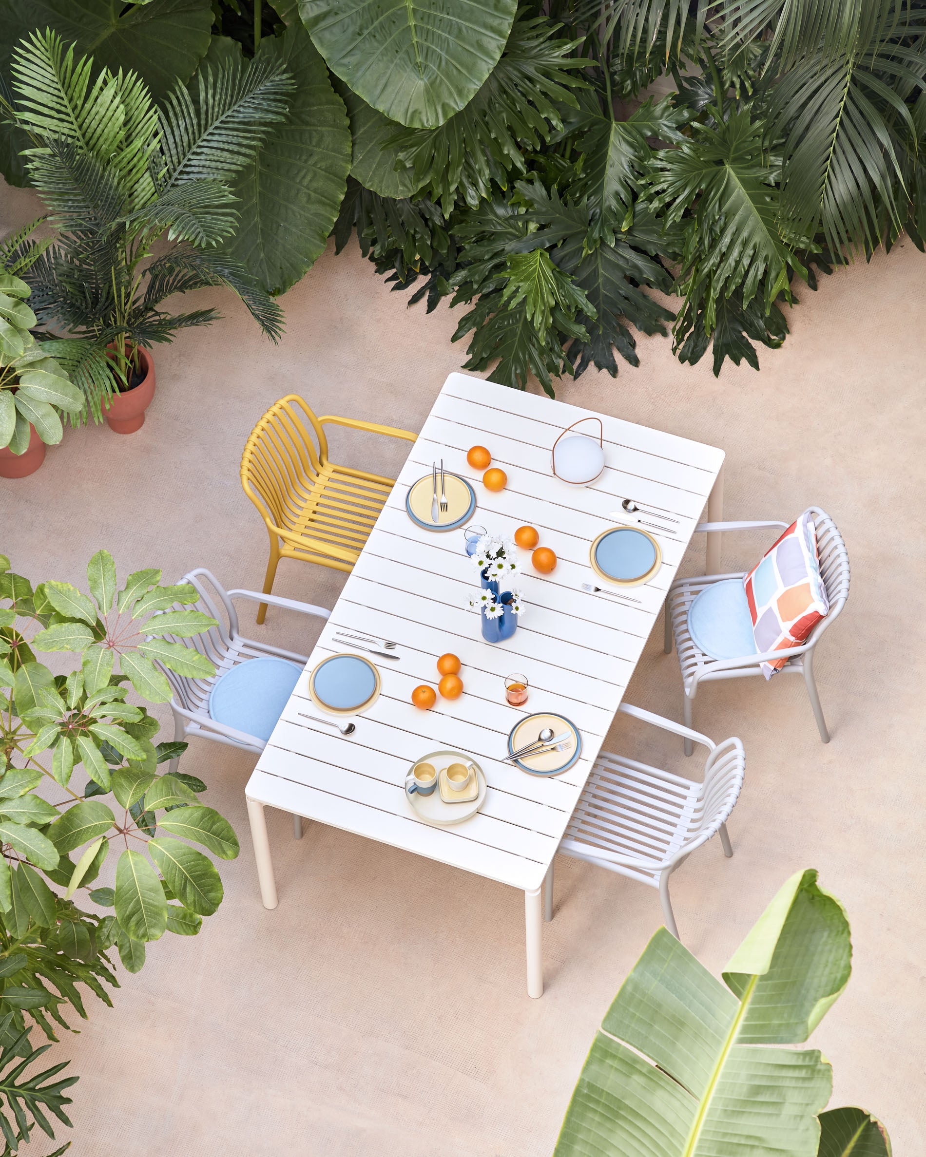 Isabellini stackable outdoor chair in yellow - Lifestyle