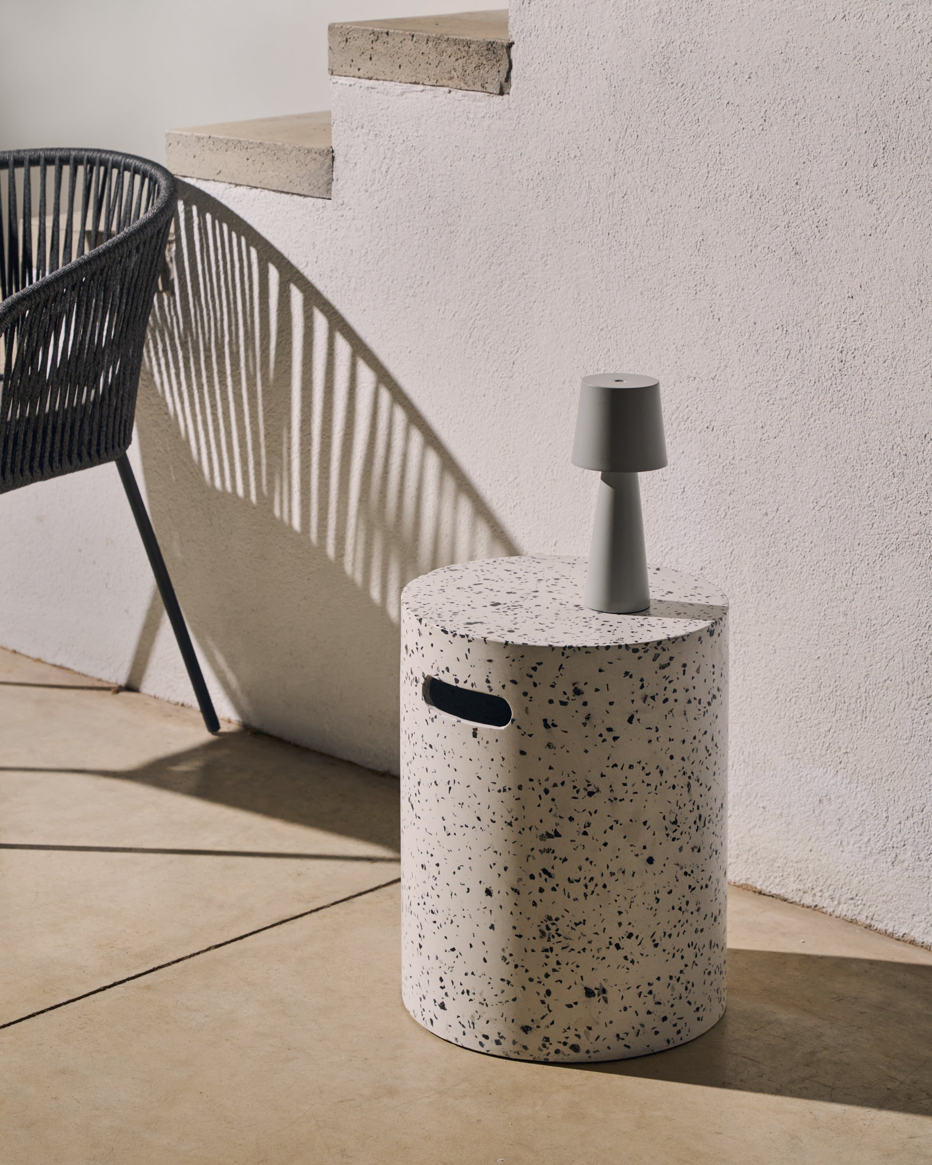 Jenell outdoor terrazzo footrest in white, Ø 35 cm - Lifestyle