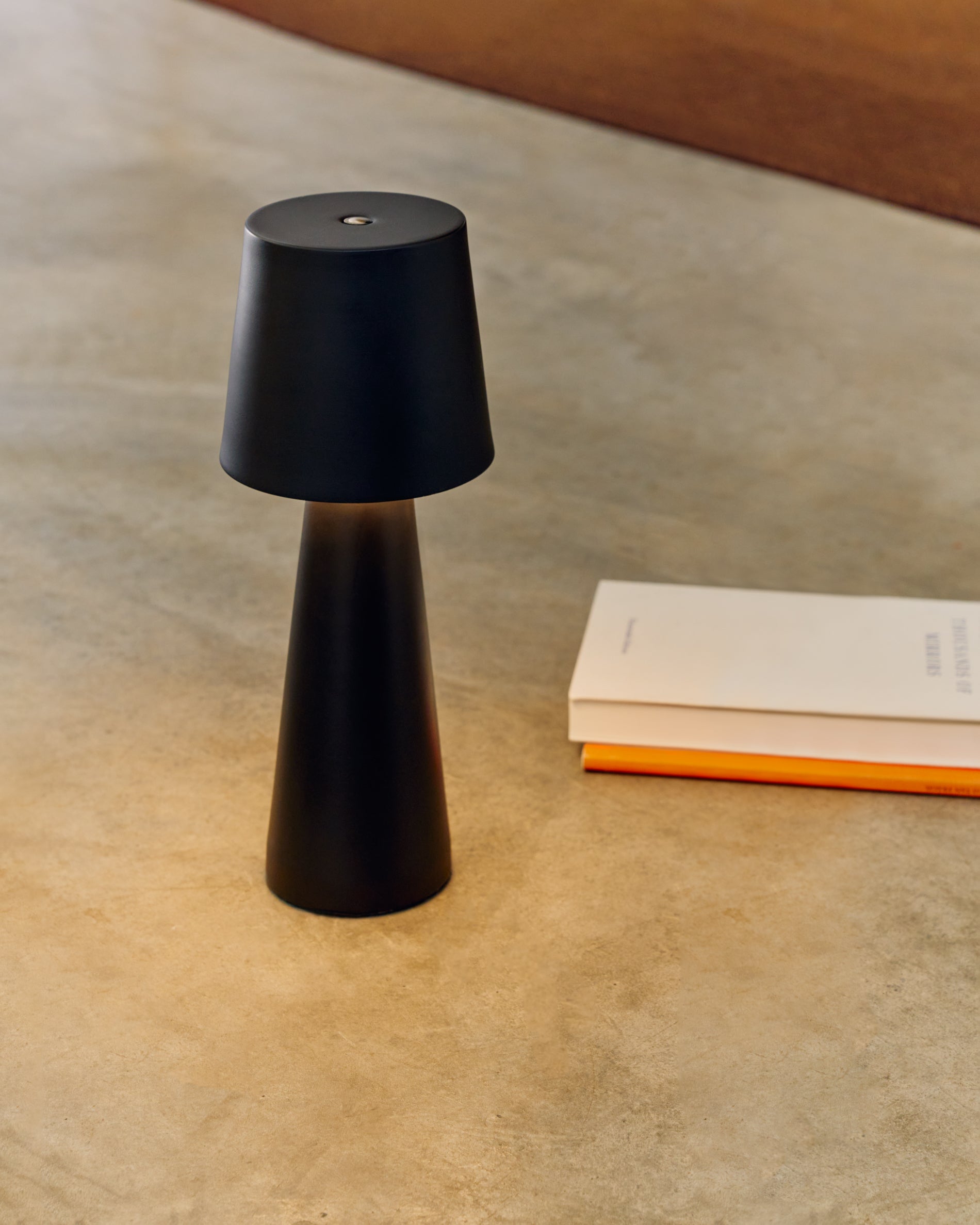 Arenys small outdoor metal table lamp in a black painted finish - Lifestyle