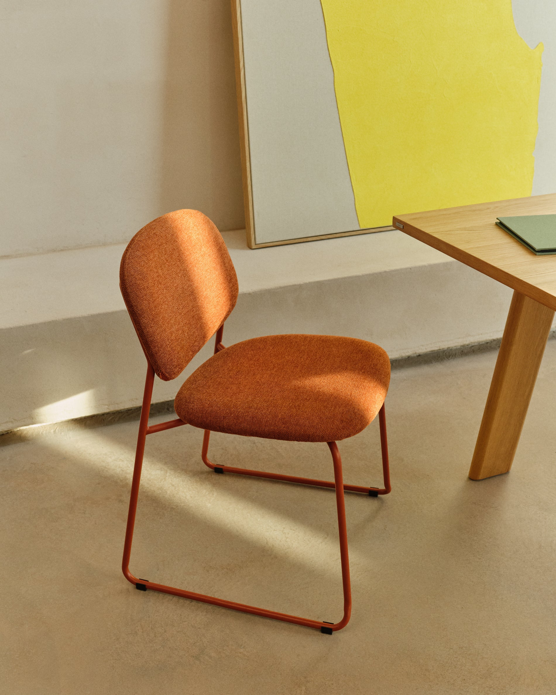 Meli stackable chair in terracotta chenille with terracotta metal legs FSC Mix Credit - Lifestyle
