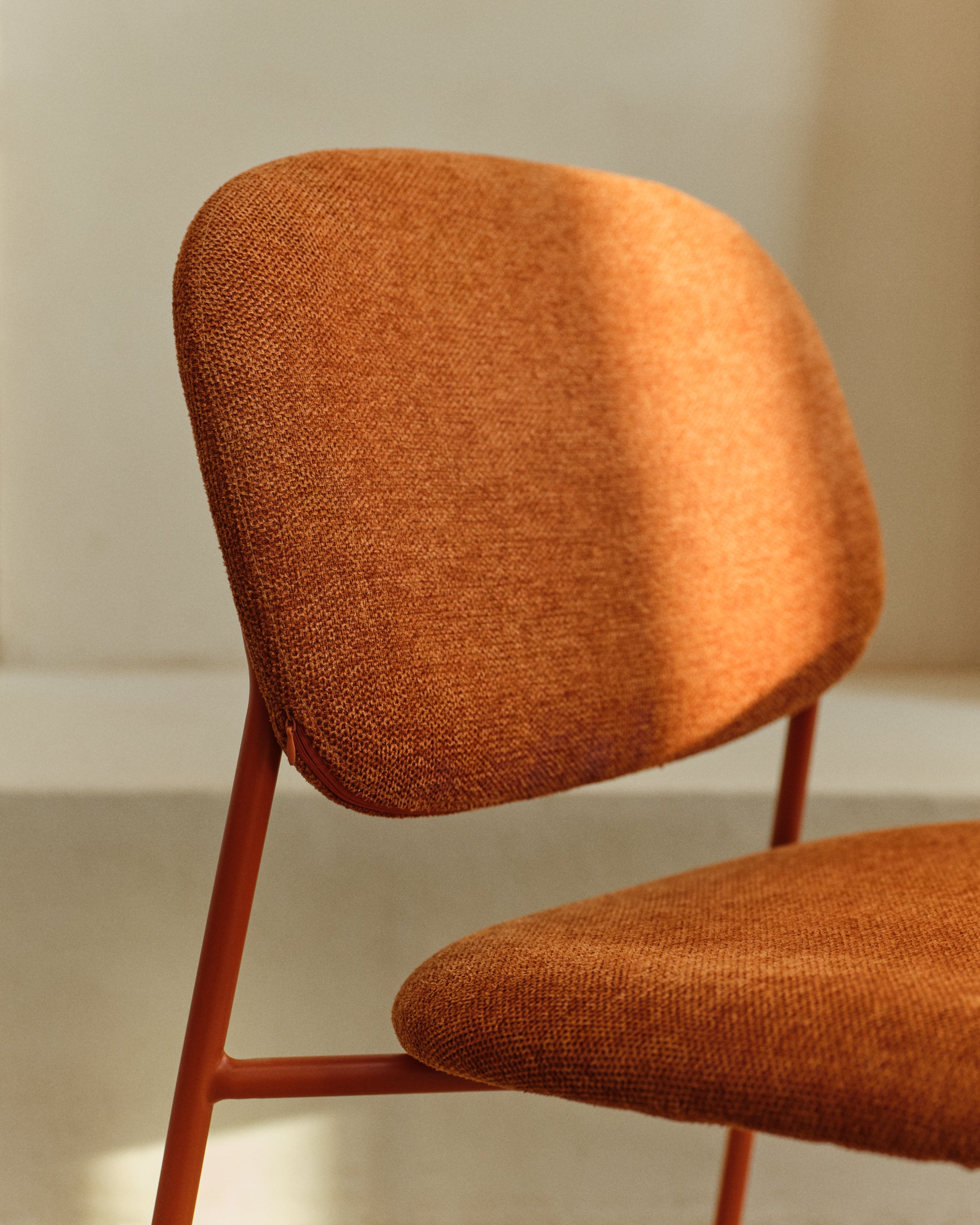 Meli stackable chair in terracotta chenille with terracotta metal legs FSC Mix Credit - Lifestyle