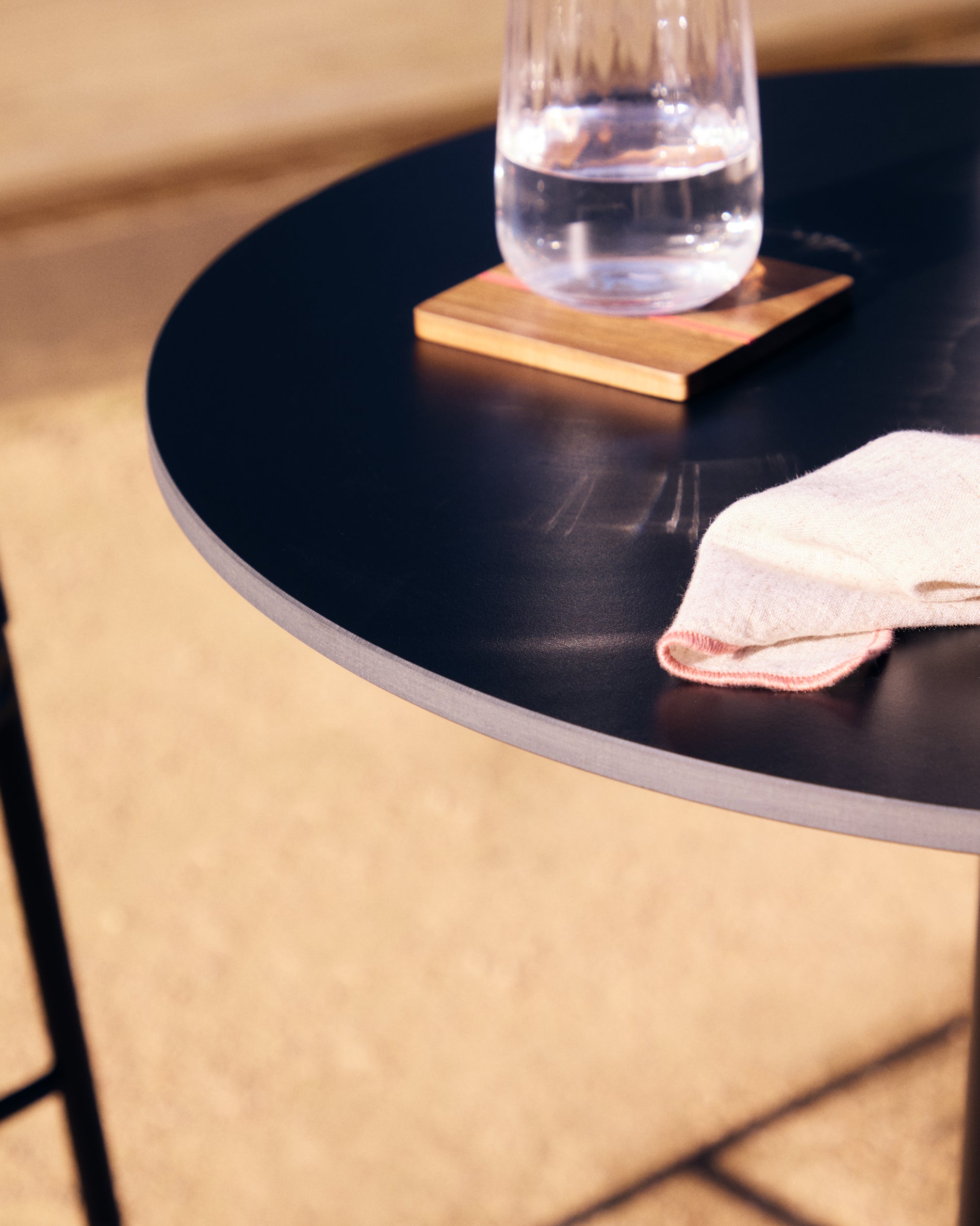 Esilda high round outdoor table in black with metal leg in a painted black finish, Ø 60 x 96 cm - Lifestyle