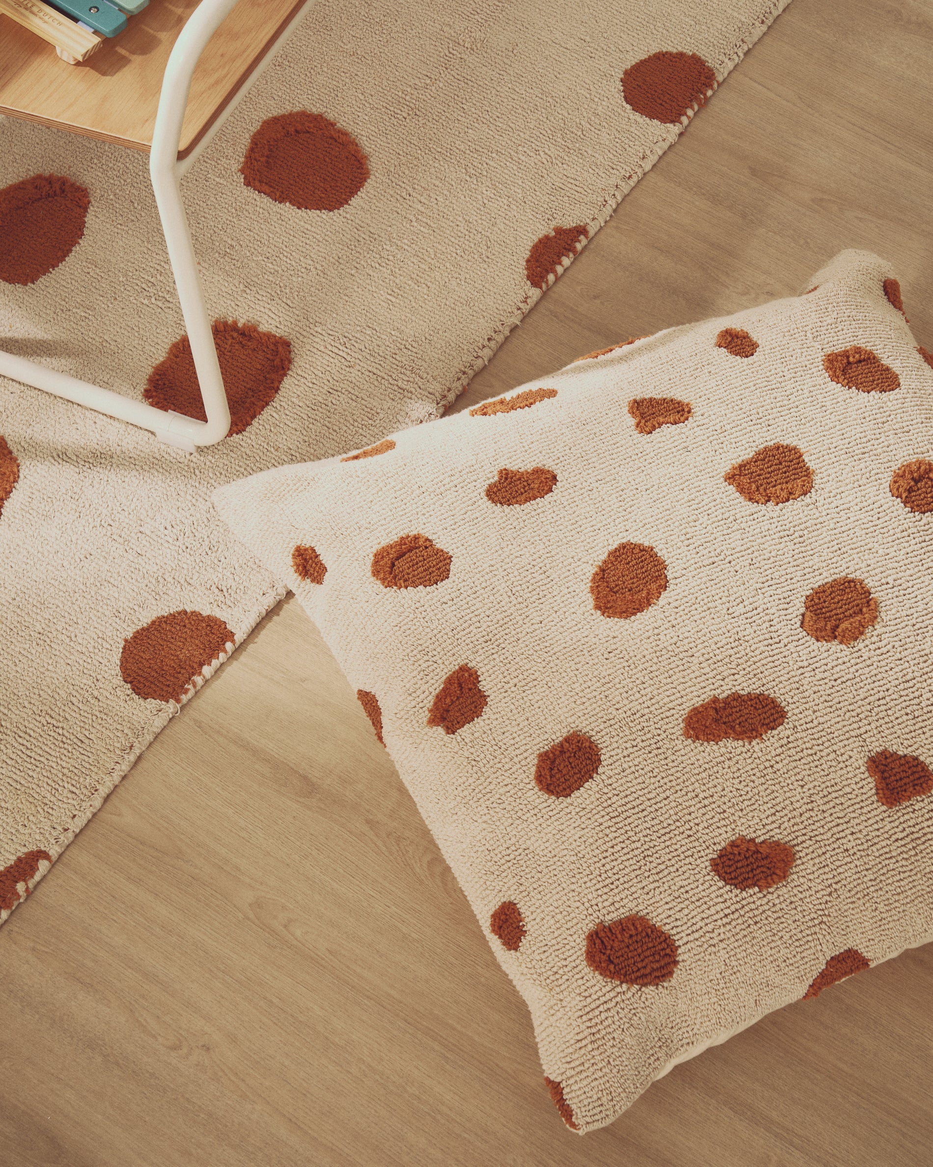 Tandani beige cotton floor cushion with orange cheetah design 70 x 70cm - Lifestyle