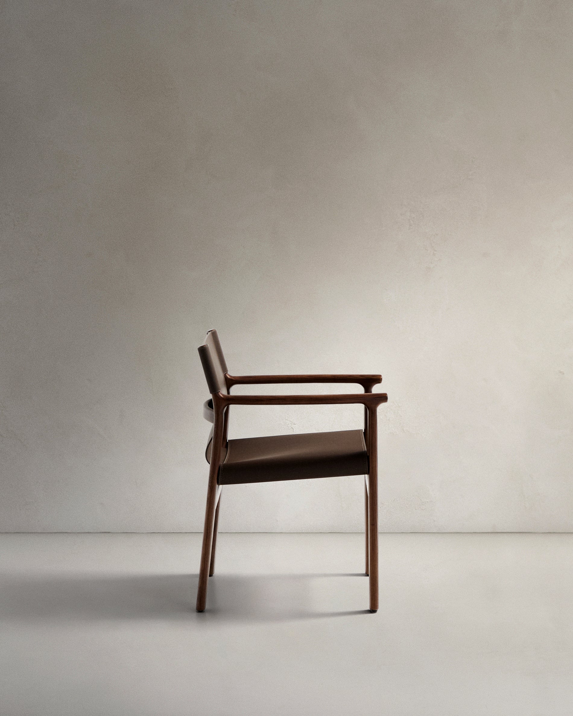 Jan chair made of dark brown recycled leather fibres and FSC 100% solid ash wood with walnut-coloured finish - Product View
