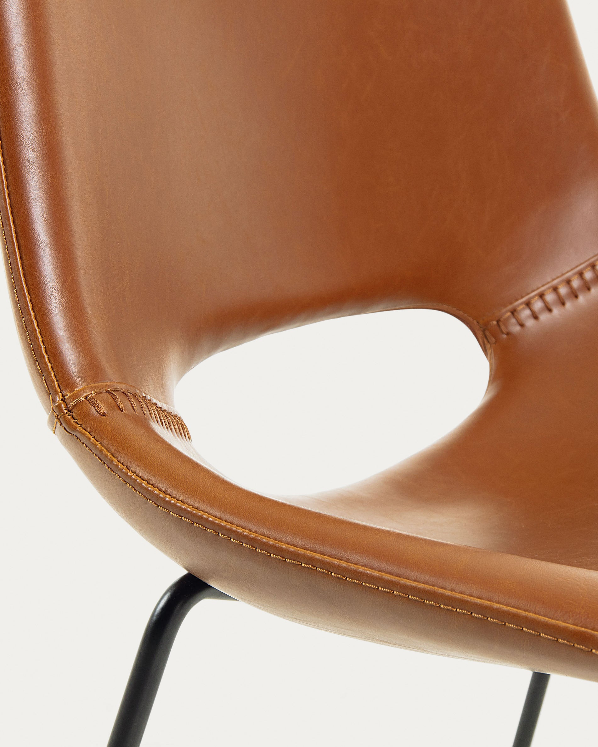 Zahara synthetic leather brown chair with steel legs with black finish - Detail