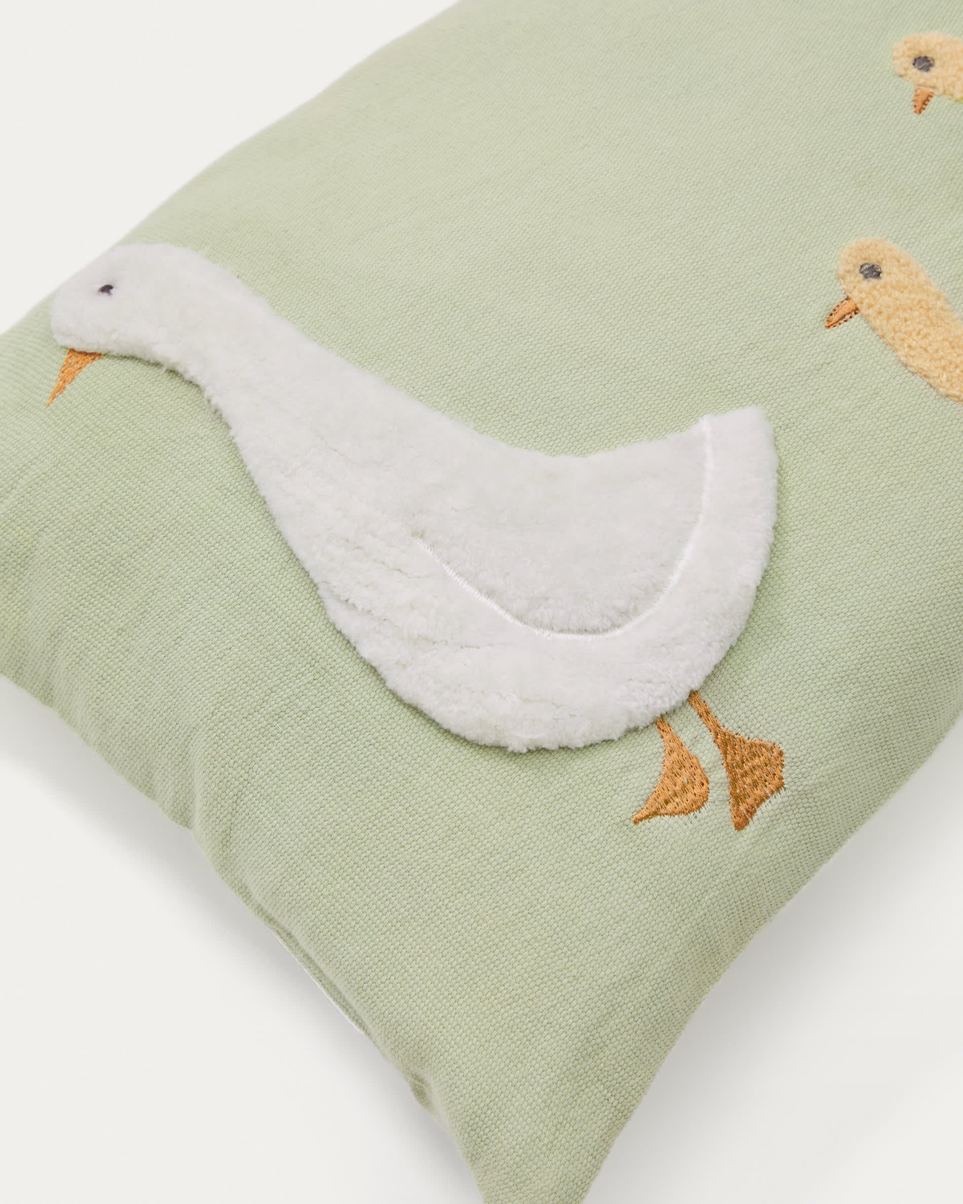Milu cushion cover in green cotton with a goose embroidery feature, 30 x 50 cm