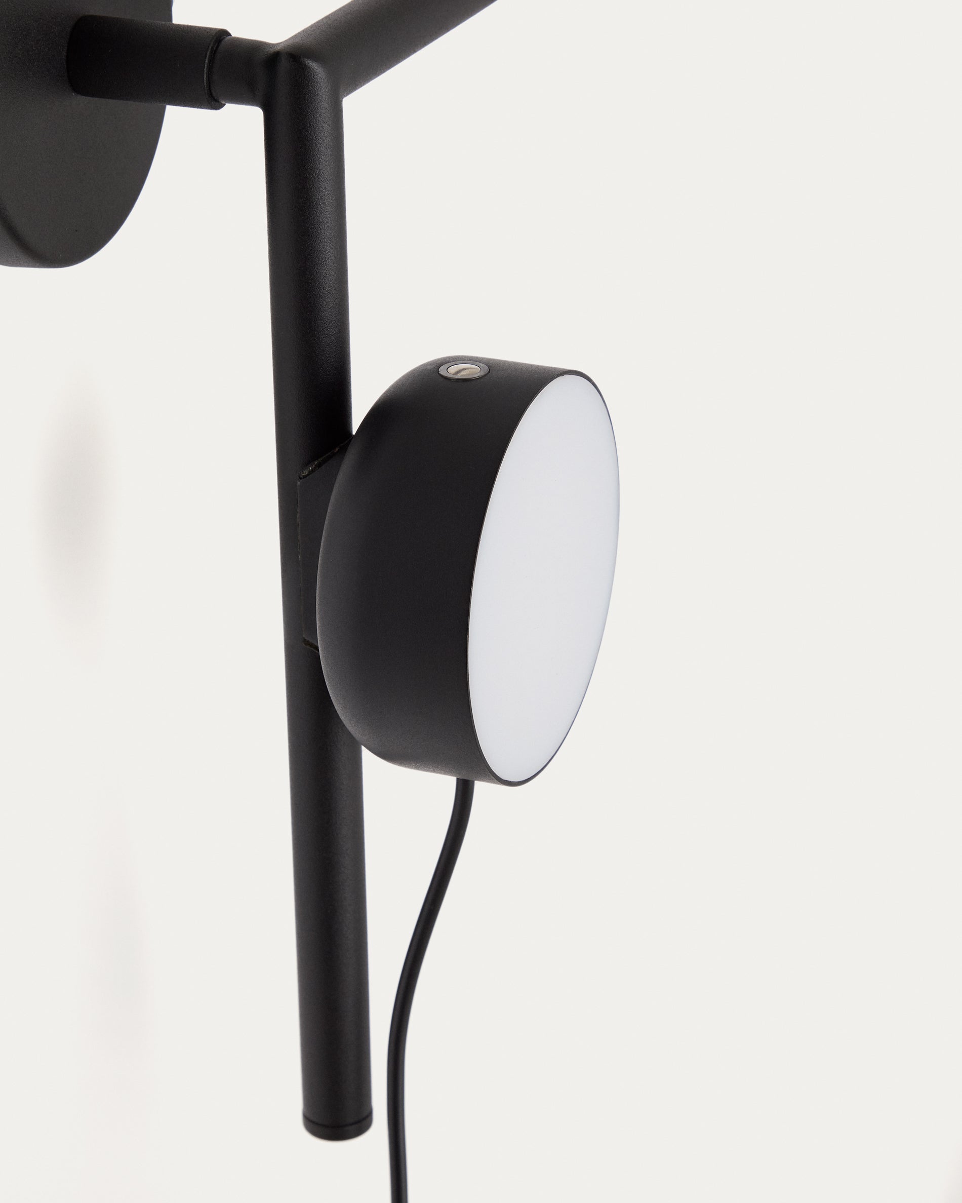 Orey black metal wall-mounted light fixture with multi-position spotlight