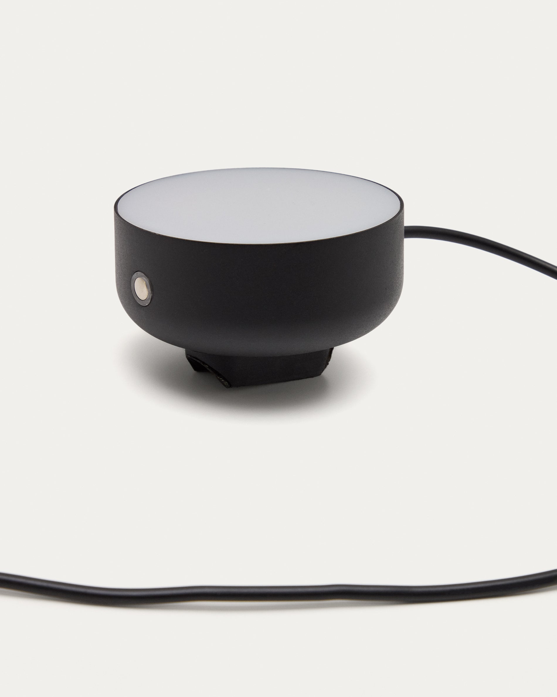Orey black metal wall-mounted light fixture with multi-position spotlight