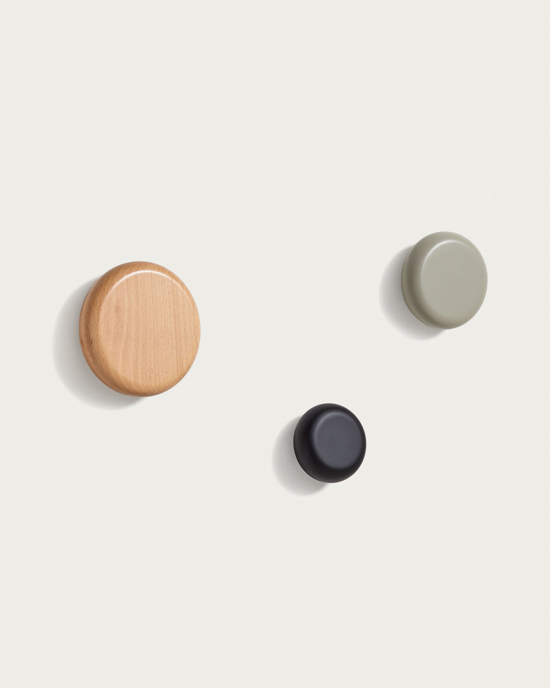 Nadue set of 3 solid beech wood wall hooks with natural, grey, and black finishes - Product View
