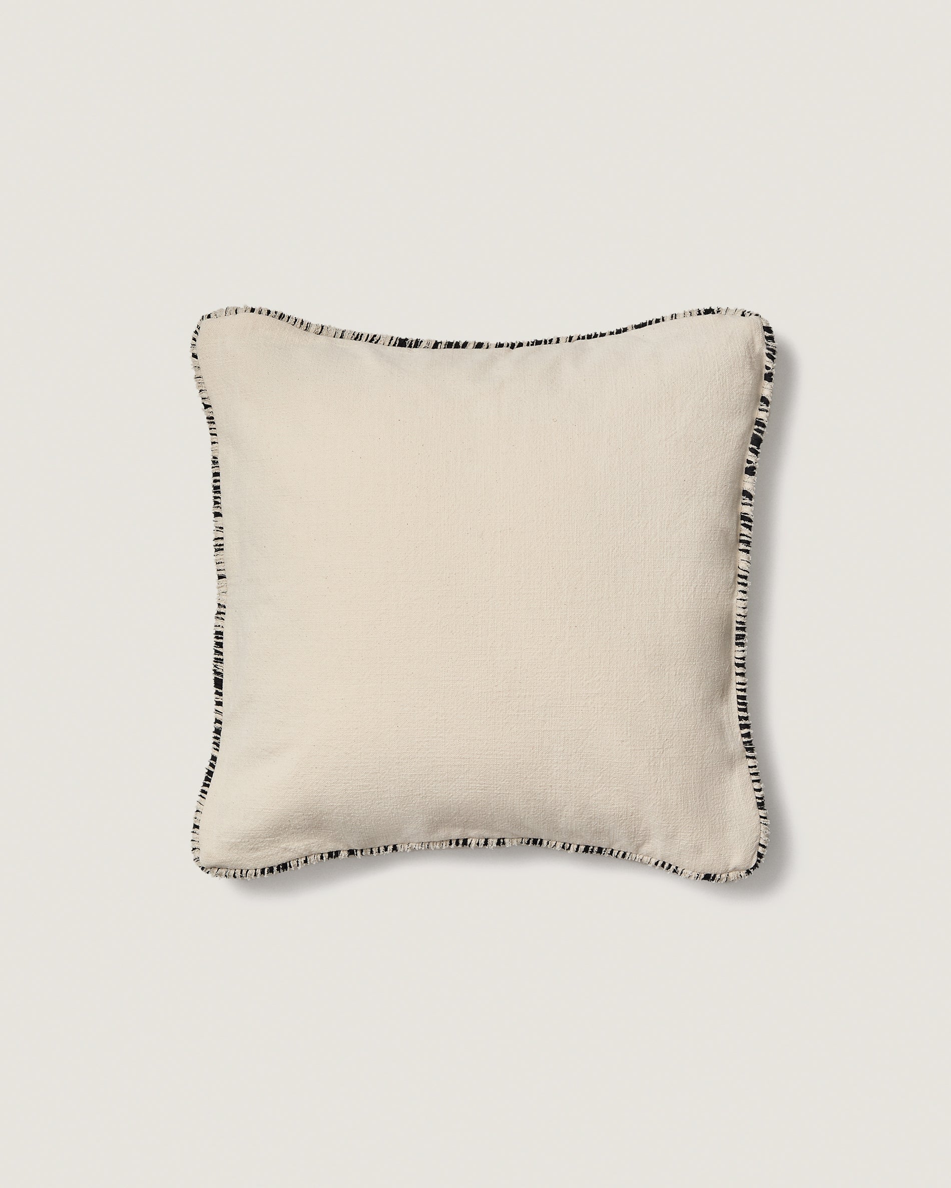 Enari beige 100% cotton cushion cover with contrasting black trim 50 x 50cm - Product View