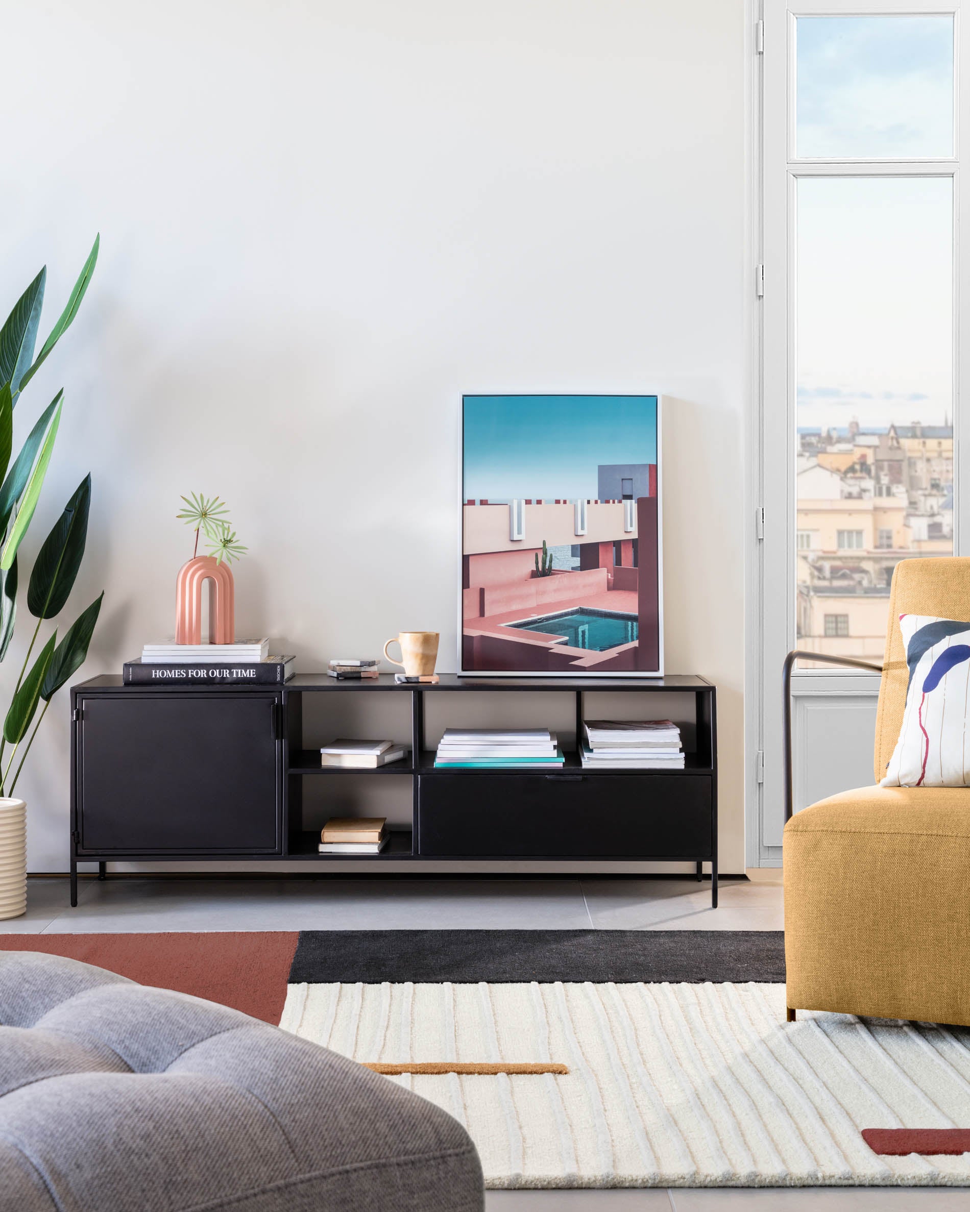 Shantay metal TV stand in a painted black finish with 1 door and drawer, 150 x 50 cm - Lifestyle