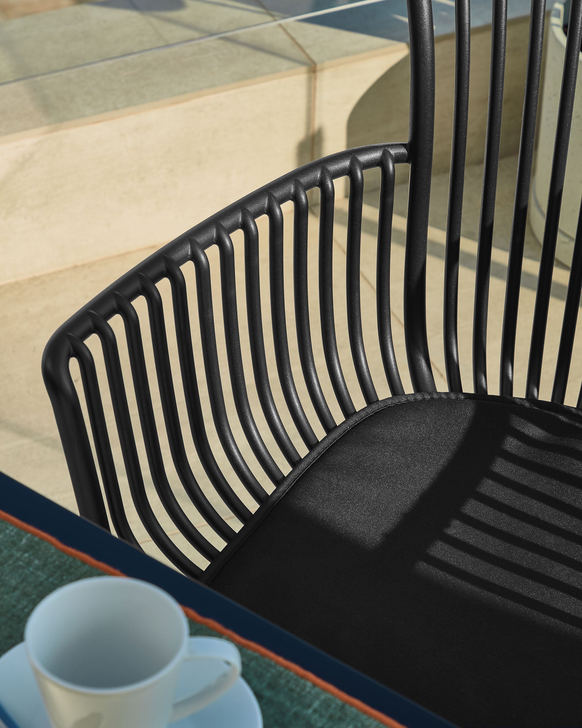 Surpika outdoor chair in black - Lifestyle