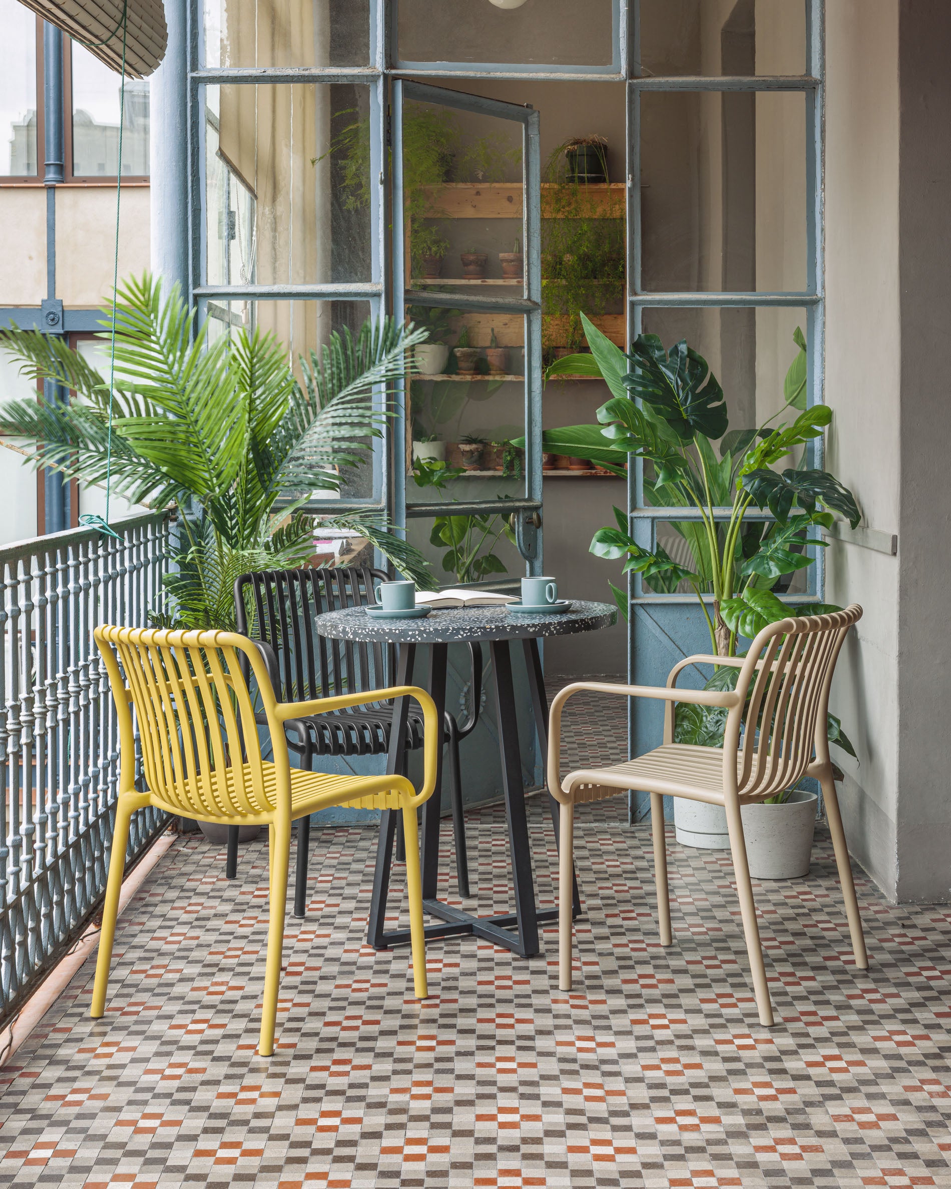 Isabellini stackable outdoor chair in beige - Lifestyle