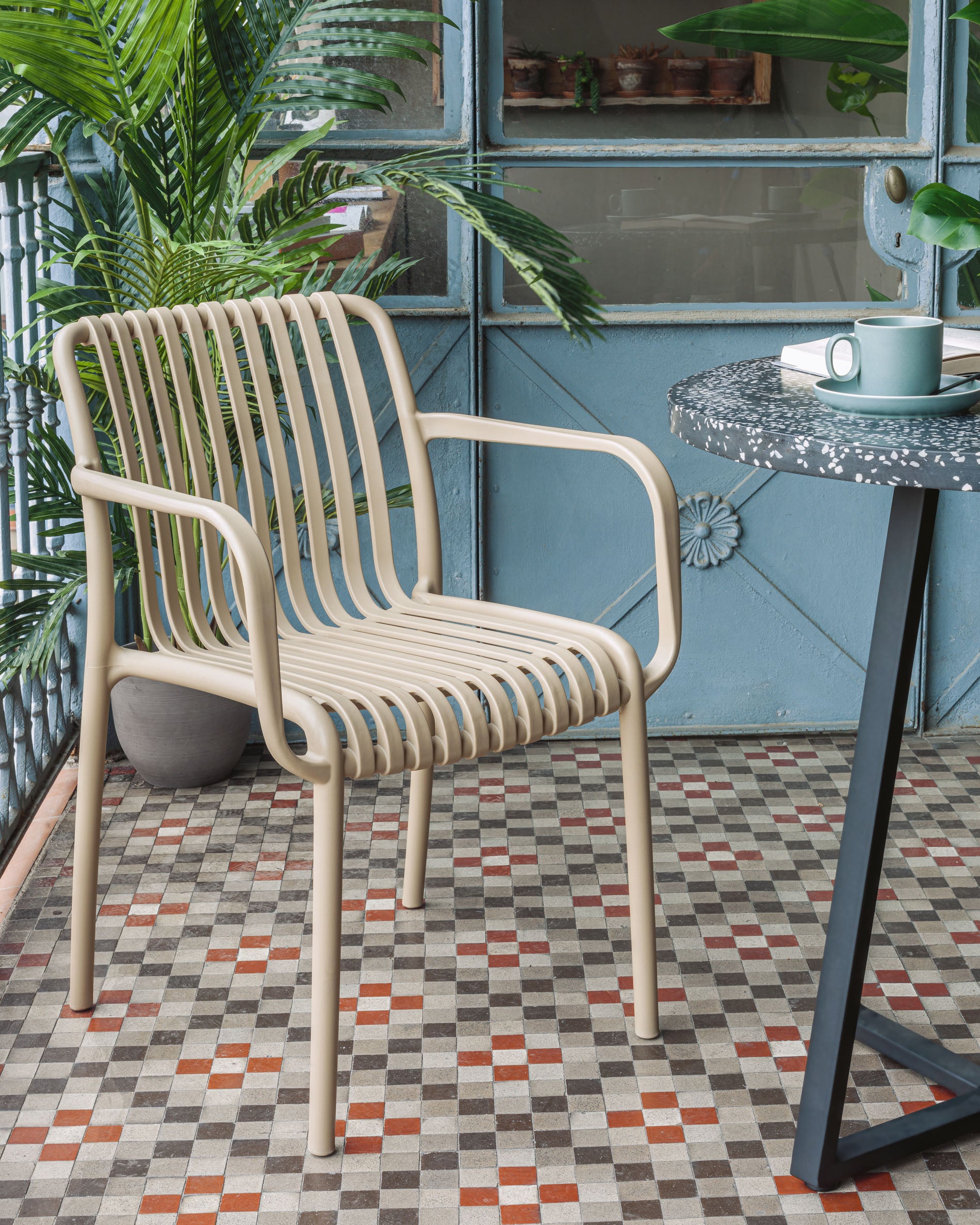 Isabellini stackable outdoor chair in beige - Lifestyle