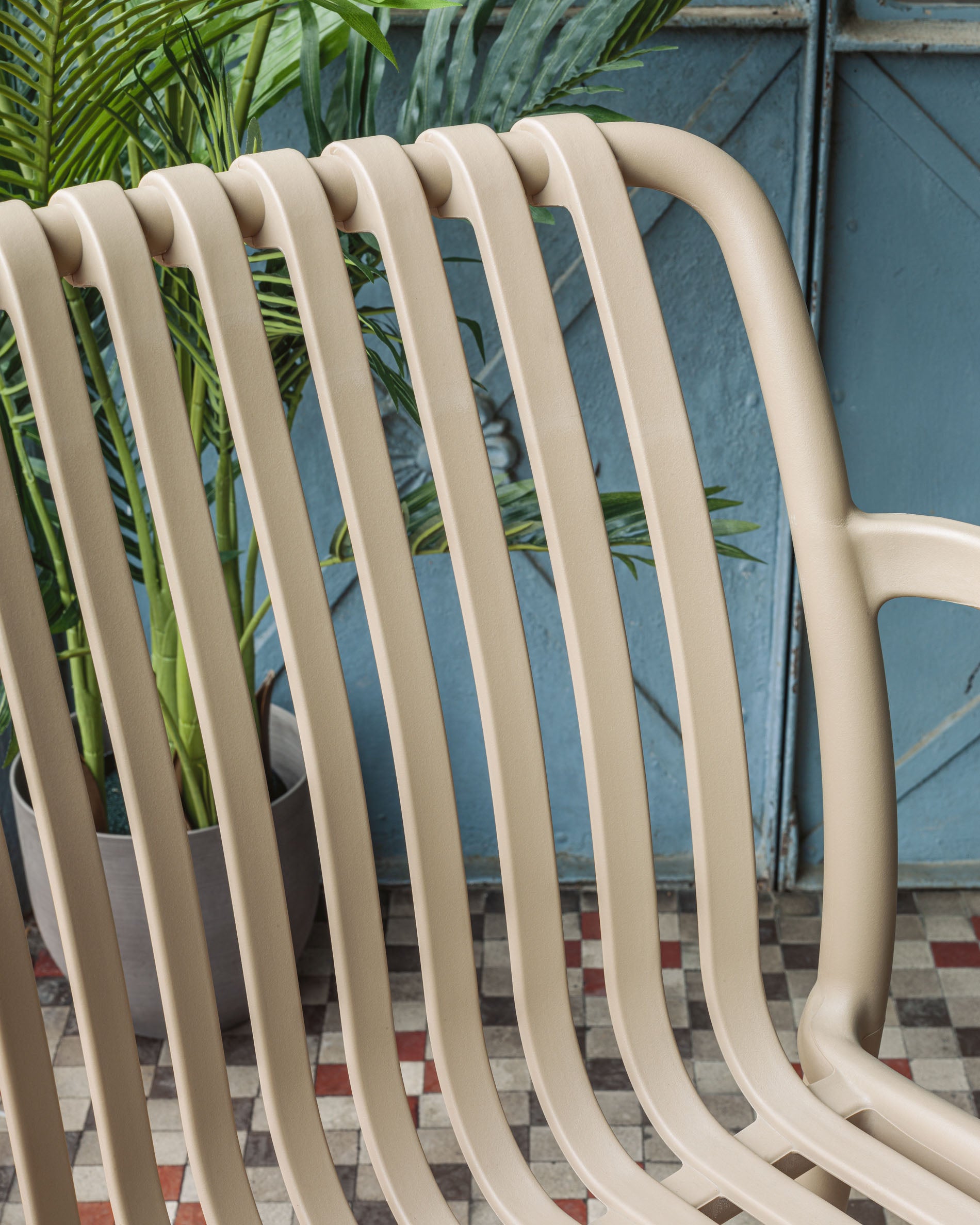 Isabellini stackable outdoor chair in beige - Lifestyle