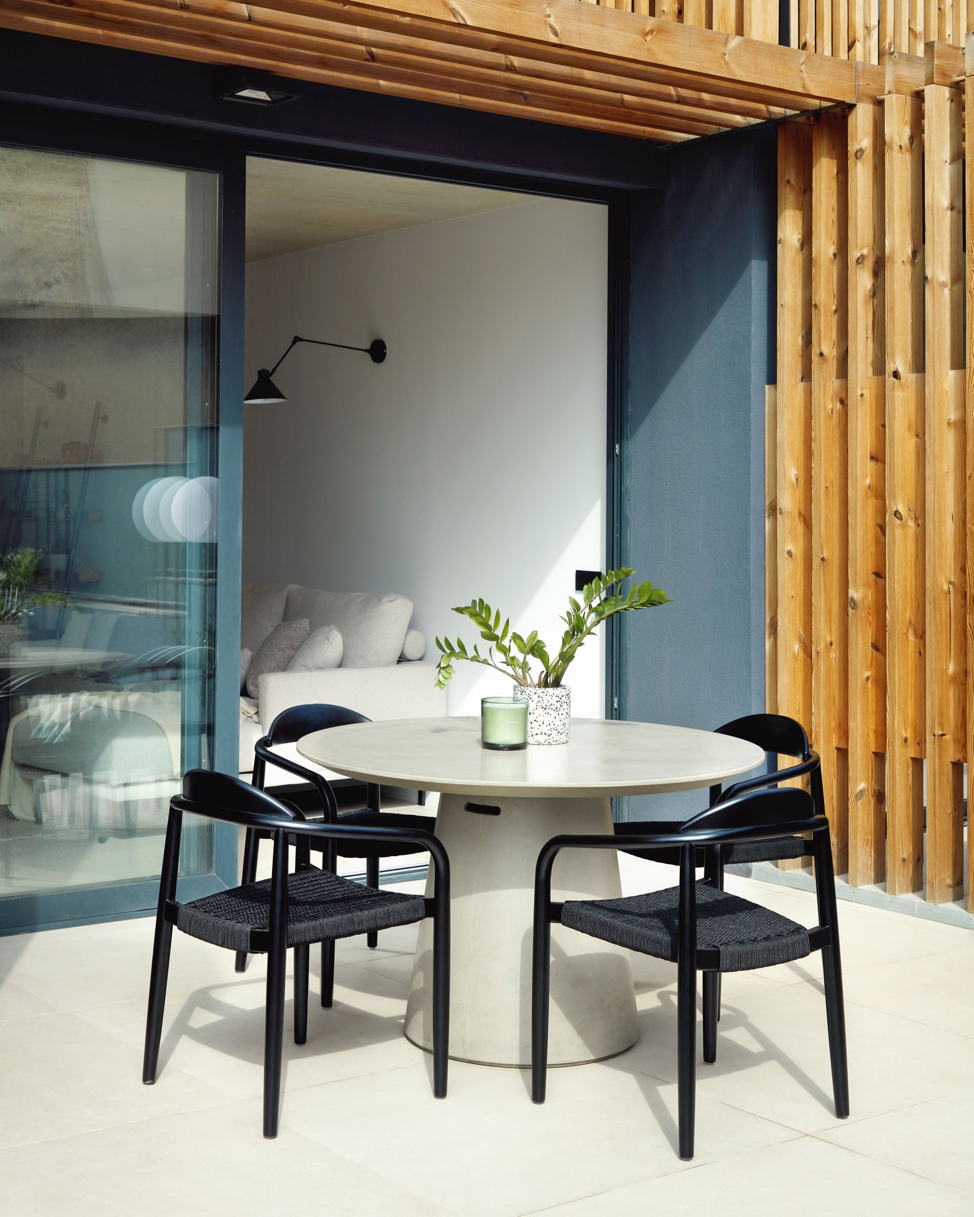 Nina stackable chair in solid acacia wood with black finish and black rope seat FSC 100% - Lifestyle