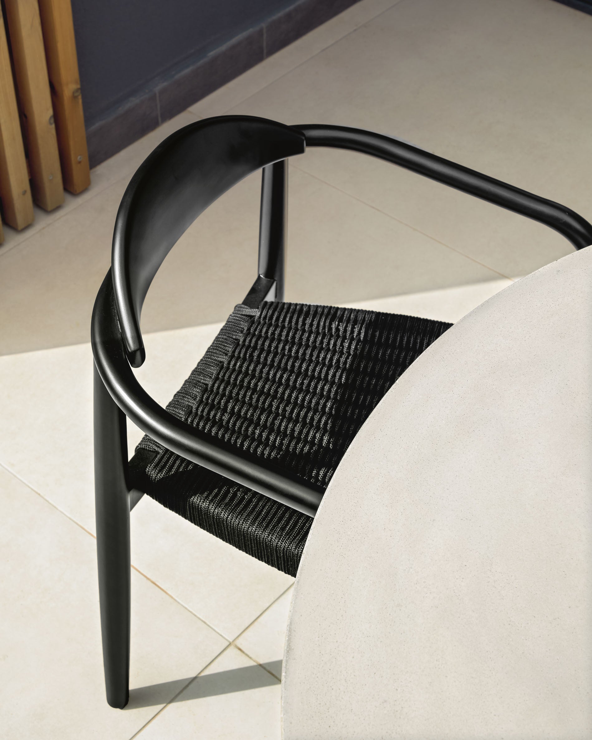 Nina stackable chair in solid acacia wood with black finish and black rope seat FSC 100% - Lifestyle