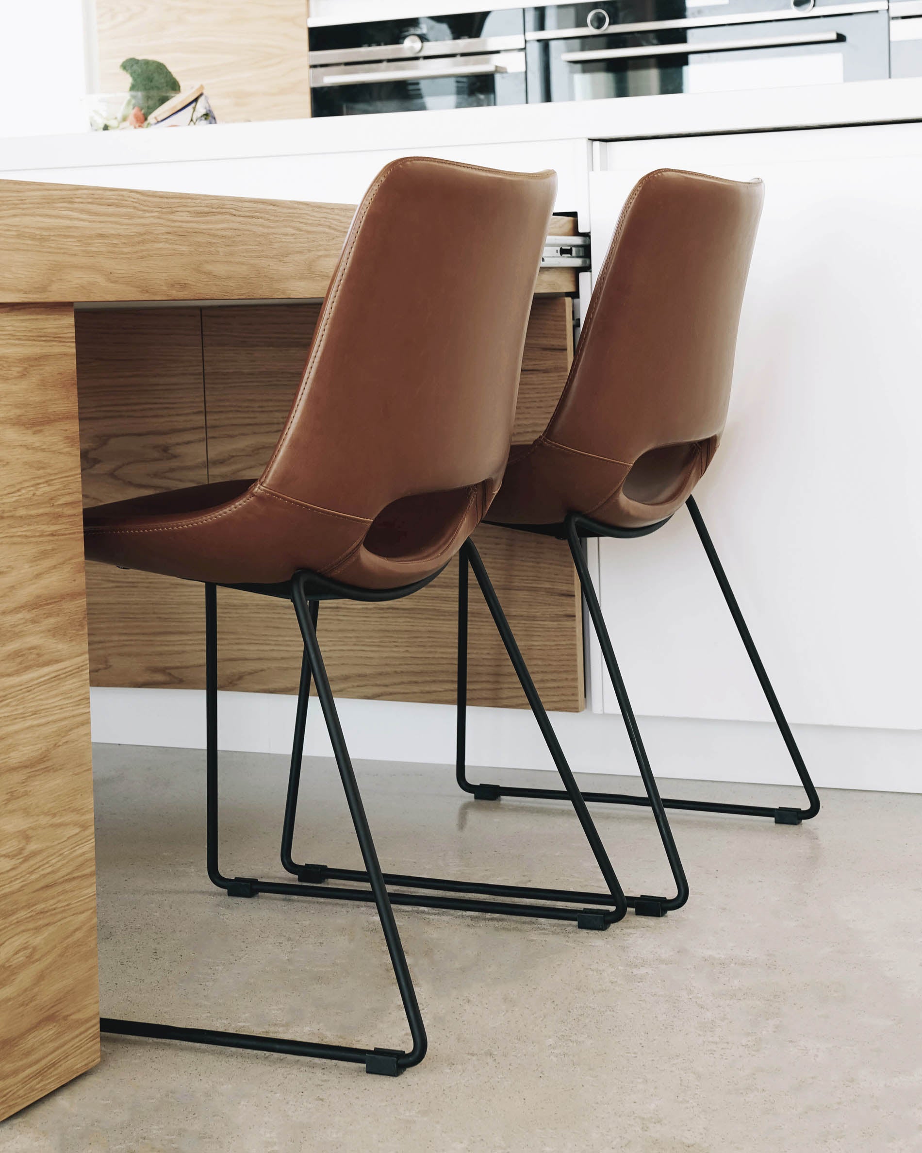 Zahara synthetic leather brown chair with steel legs with black finish - Lifestyle