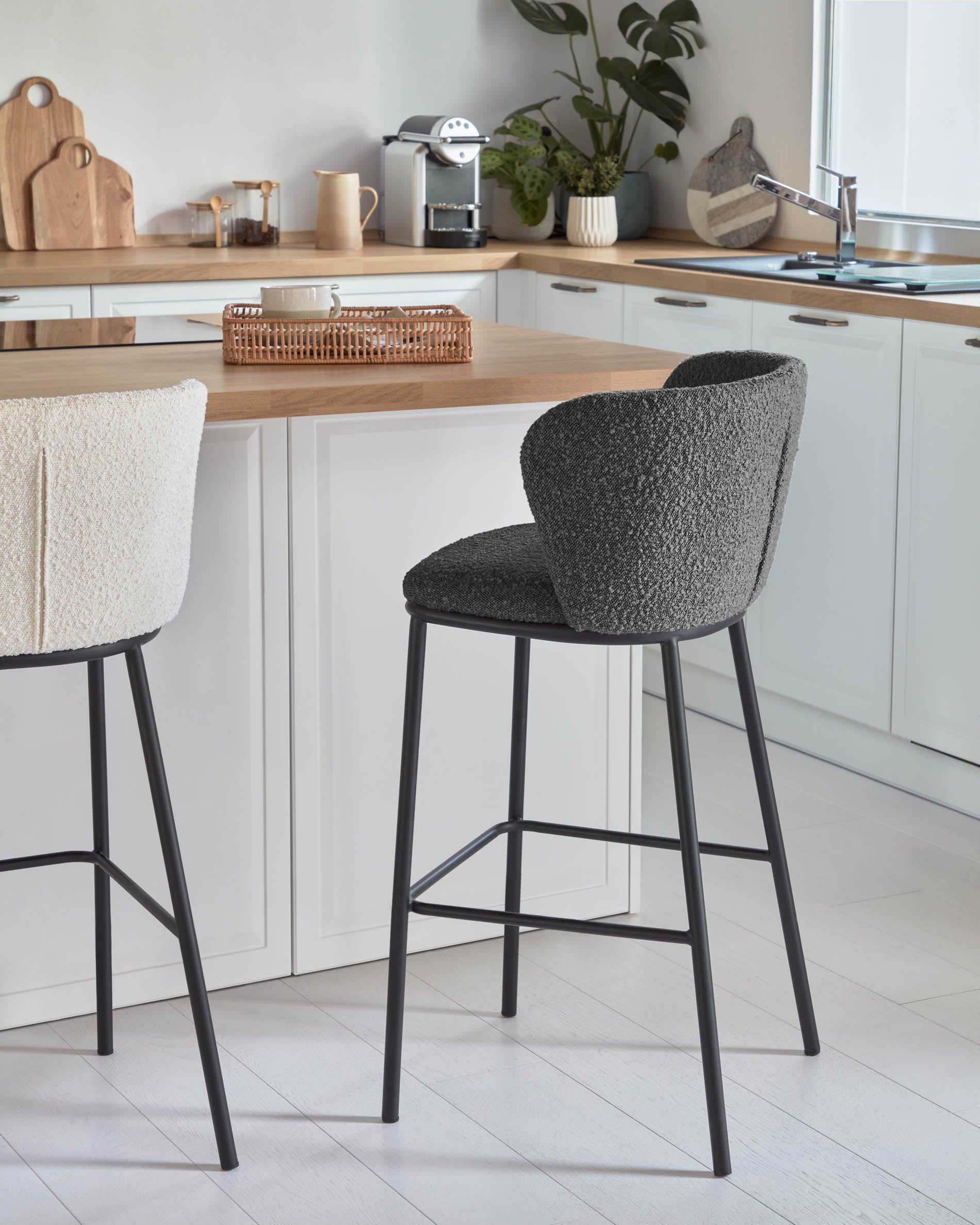 Ciselia stool with black bouclé and black steel legs, height 65 cm FSC Mix Credit - Lifestyle