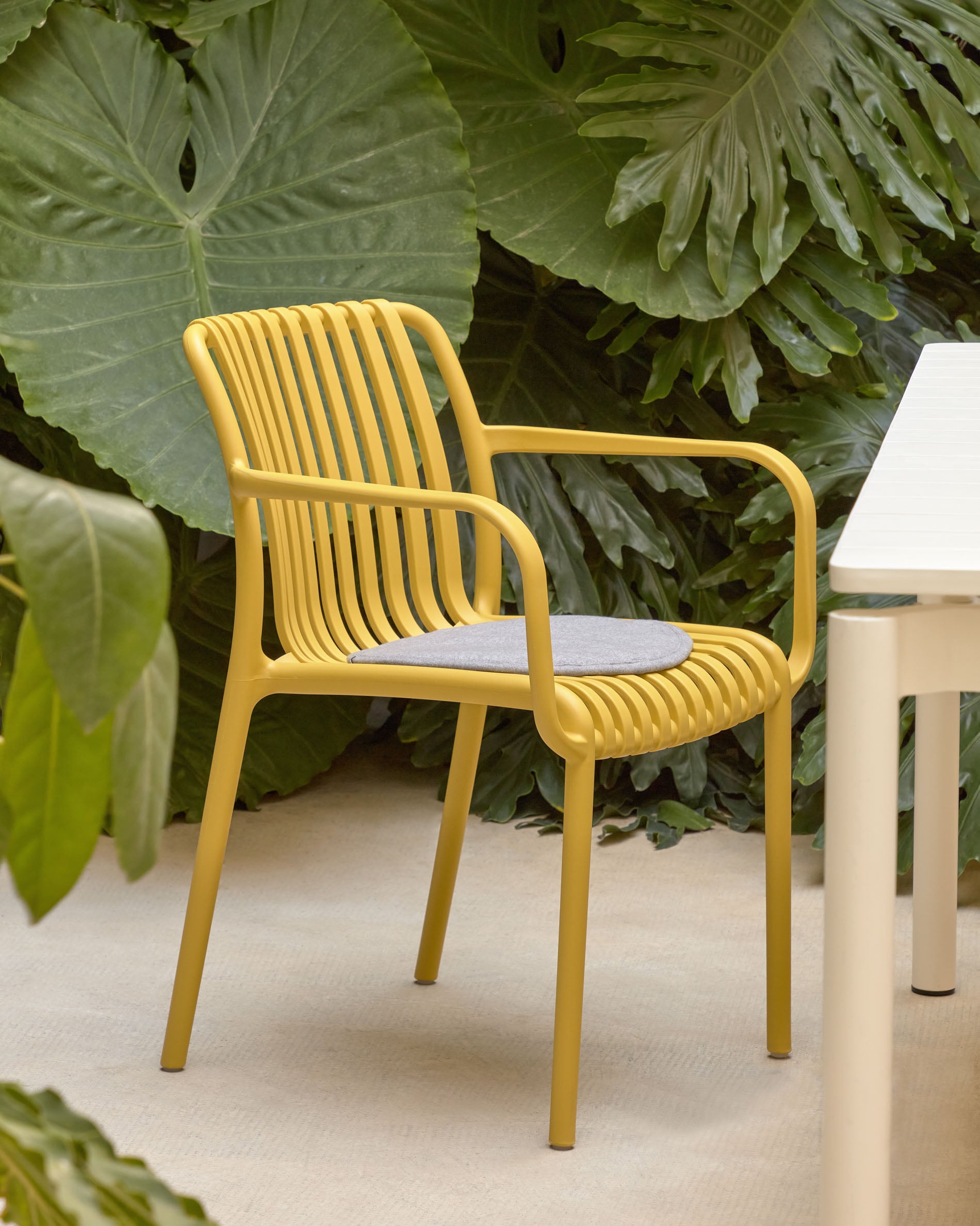 Isabellini stackable outdoor chair in yellow - Lifestyle