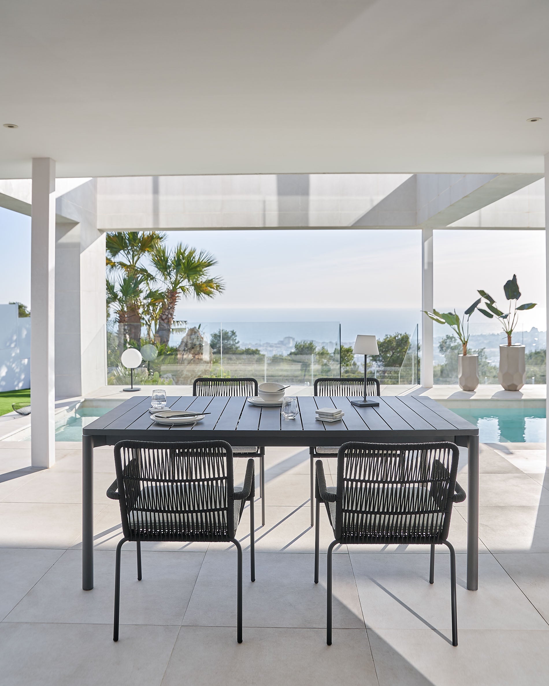 Samanta stackable chair made from black cord and galvanised steel legs. - Lifestyle