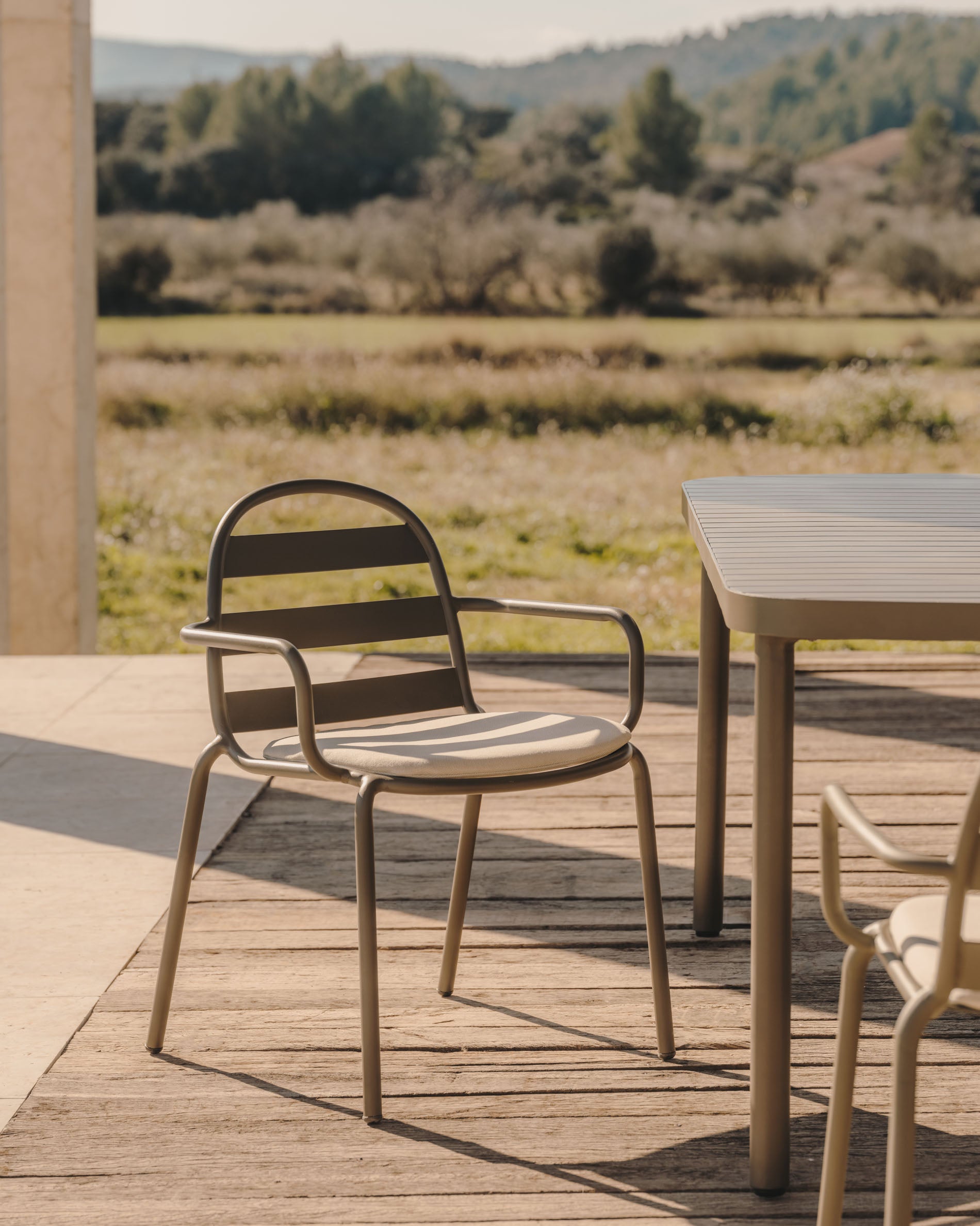 Joncols stackable outdoor aluminium chair with a powder coated green finish - Lifestyle