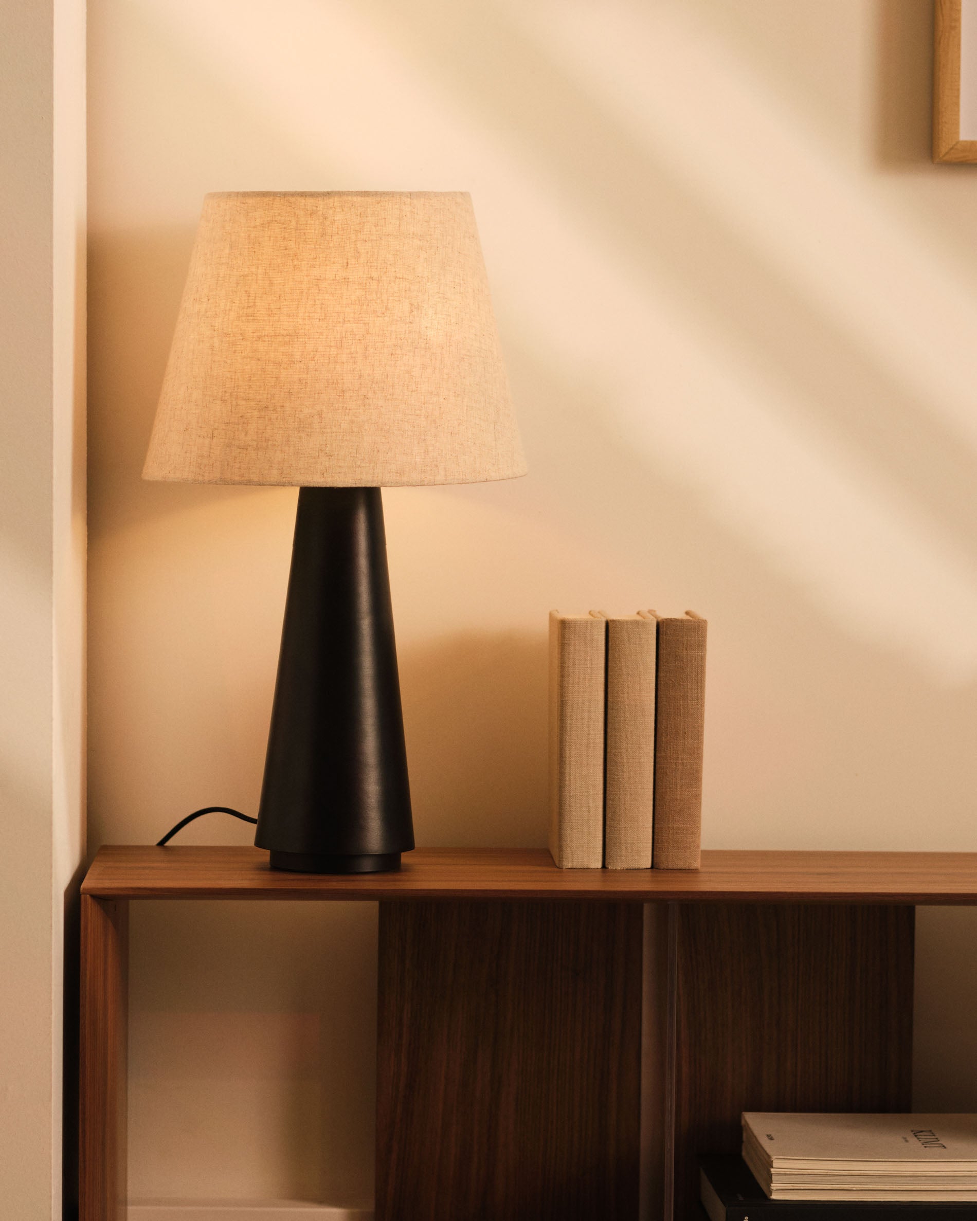 Torrent metal table lamp with black painted finish and linen shade - Lifestyle