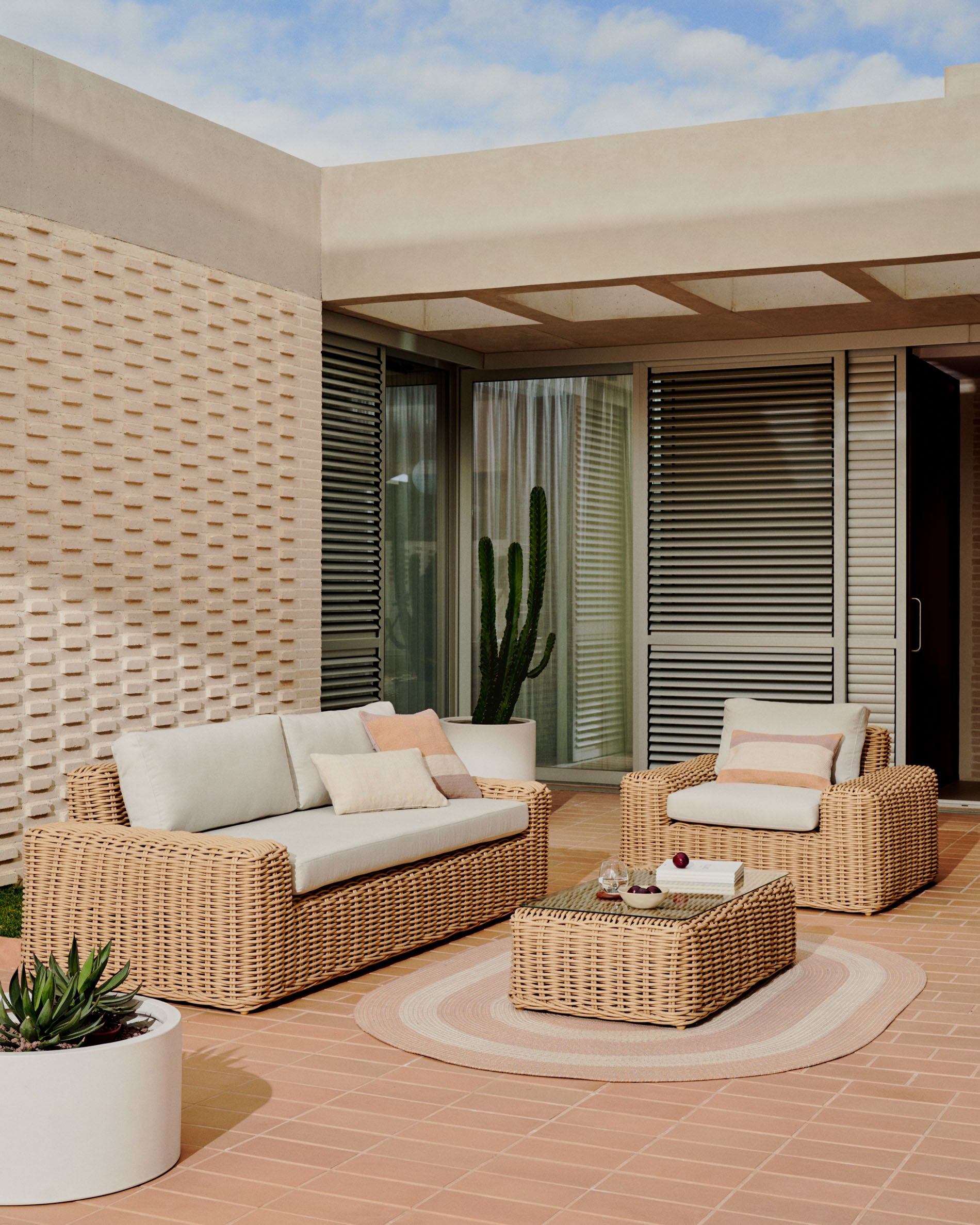 Portlligat 3 seater faux rattan outdoor sofa in a natural finish - Lifestyle