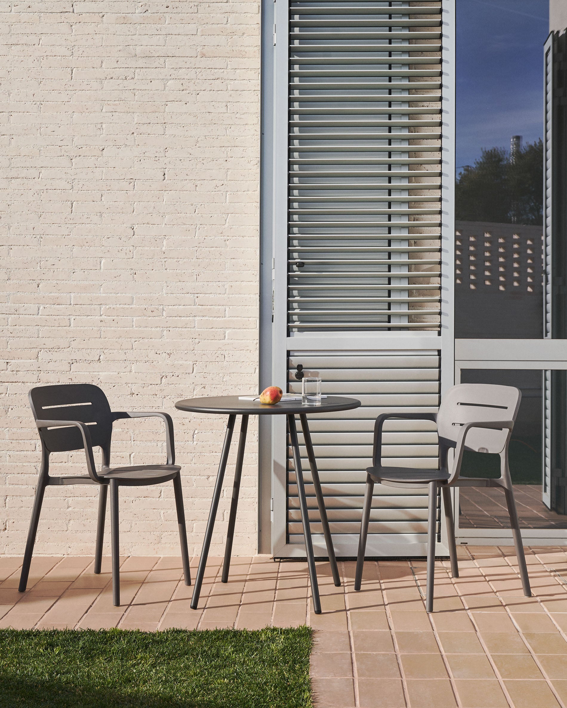 Morella stackable garden chair in grey - Lifestyle