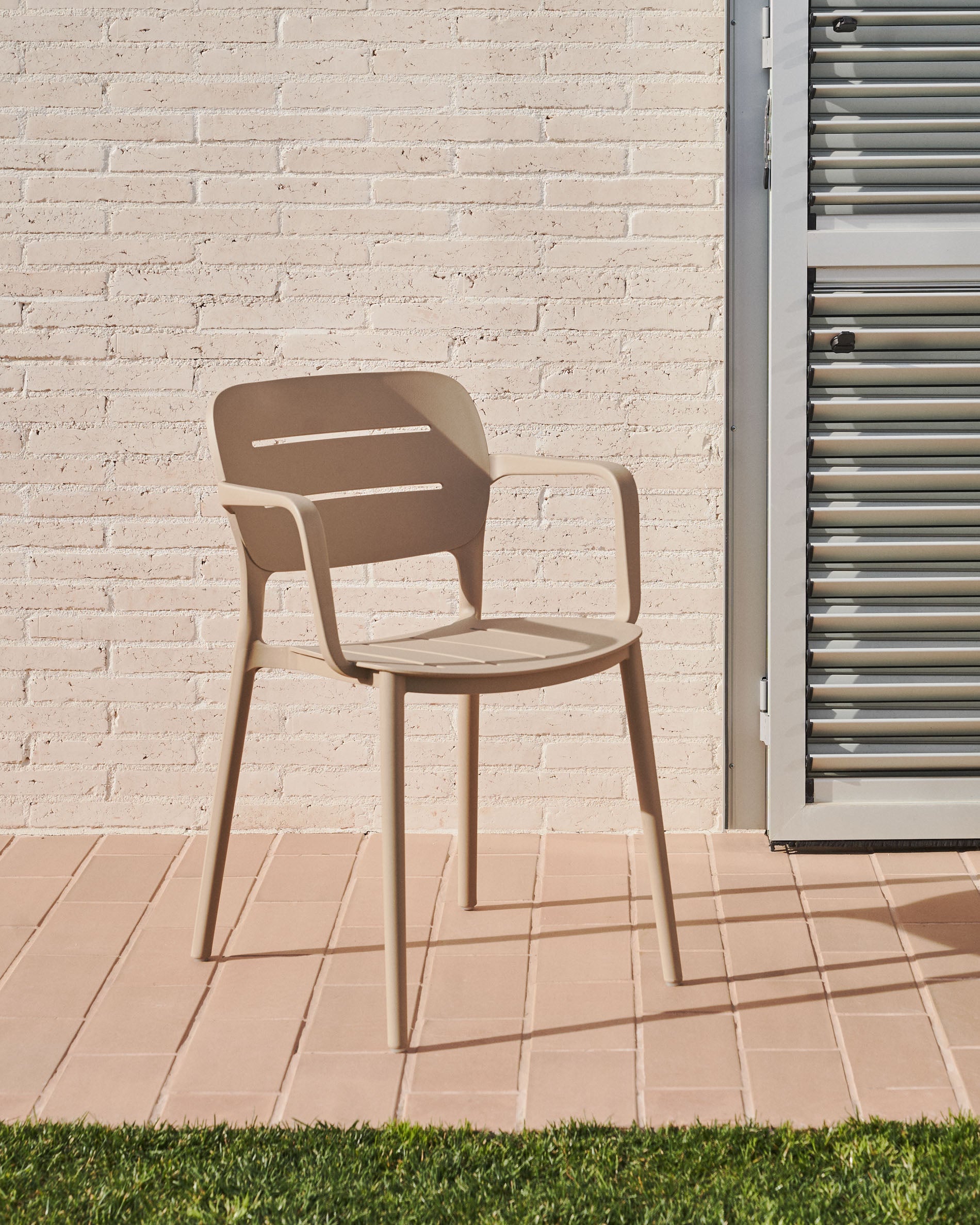 Morella stackable outdoor chair in beige - Lifestyle