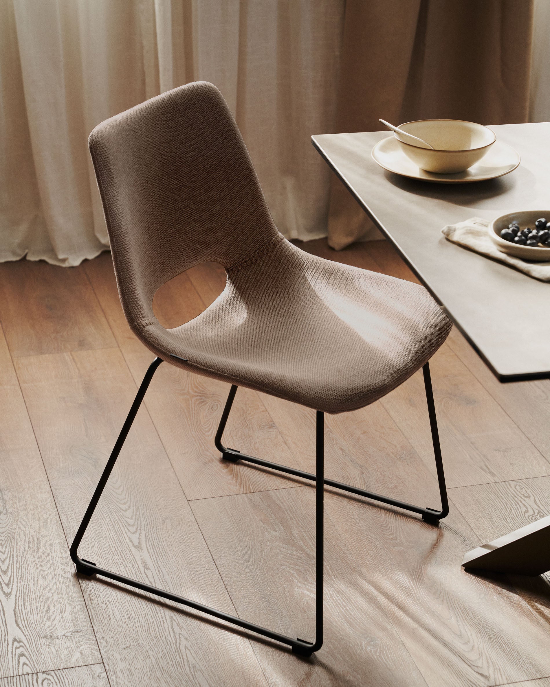 Zahara chair in brown with steel legs in a black finish - Lifestyle