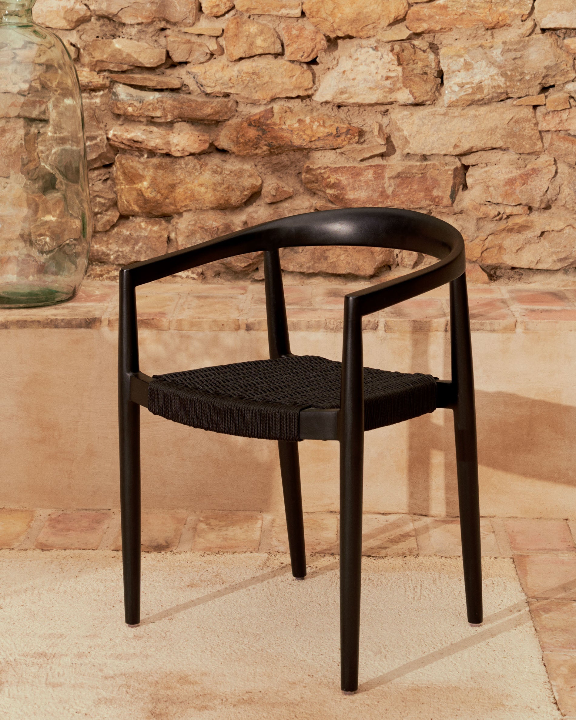 Ydalia stackable outdoor chair in solid teak wood with black finish and black rope - Lifestyle