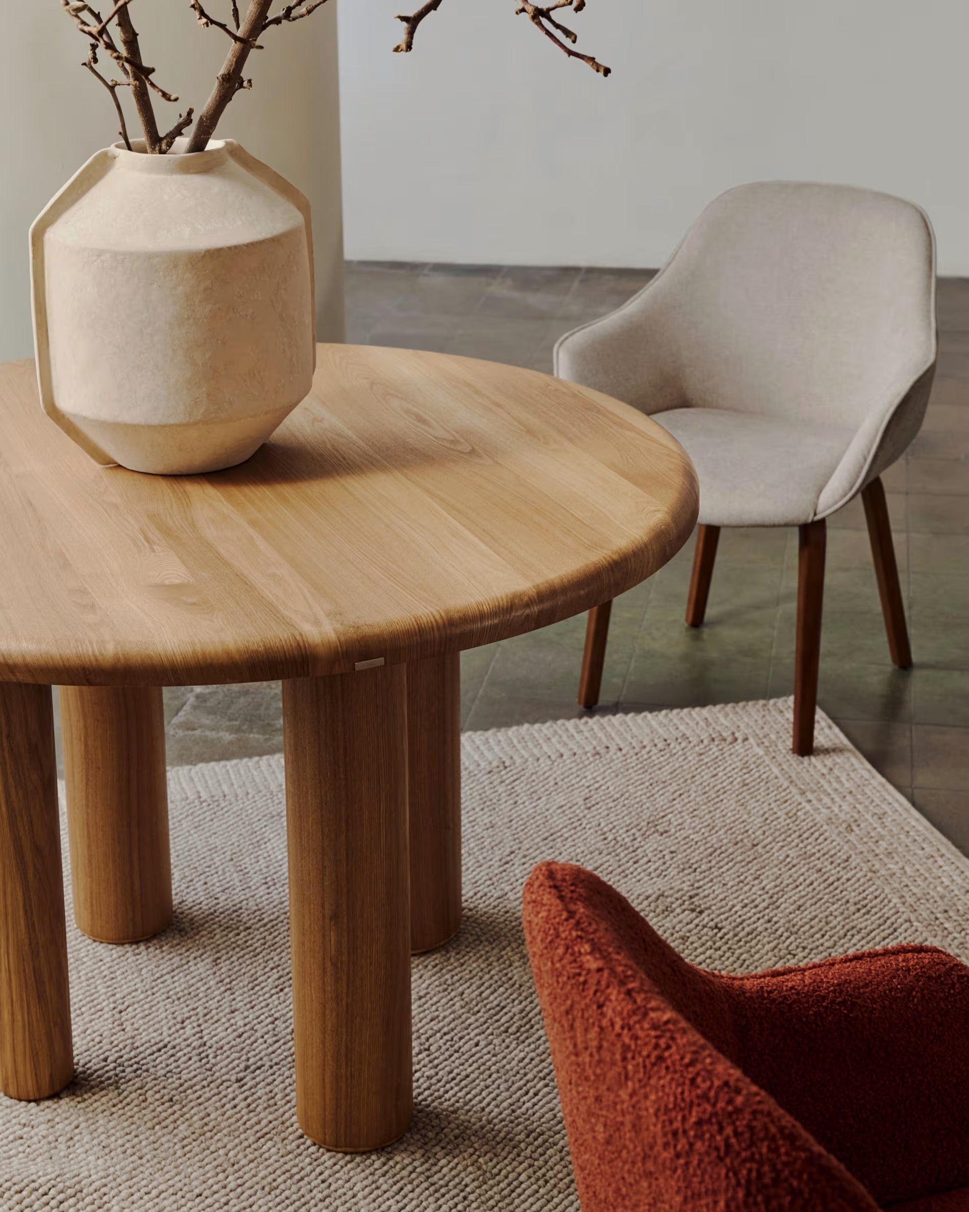 Aleli chair in beige shearling with solid ash wood legs and natural finish