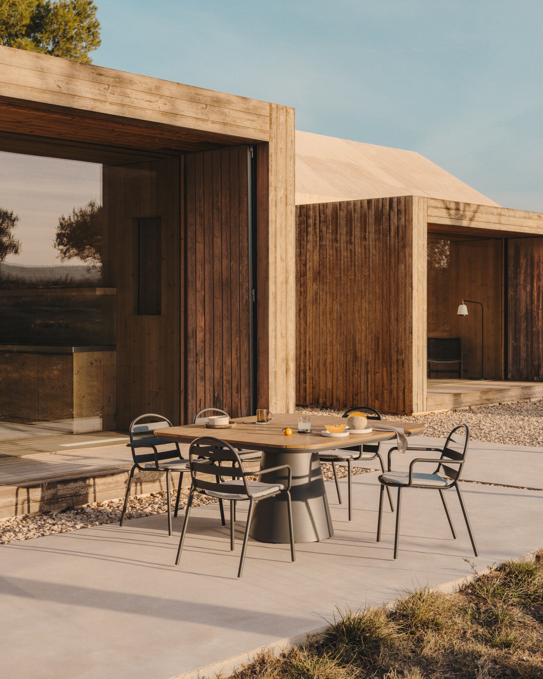 Joncols stackable outdoor aluminium chair with a powder coated grey finish - Lifestyle
