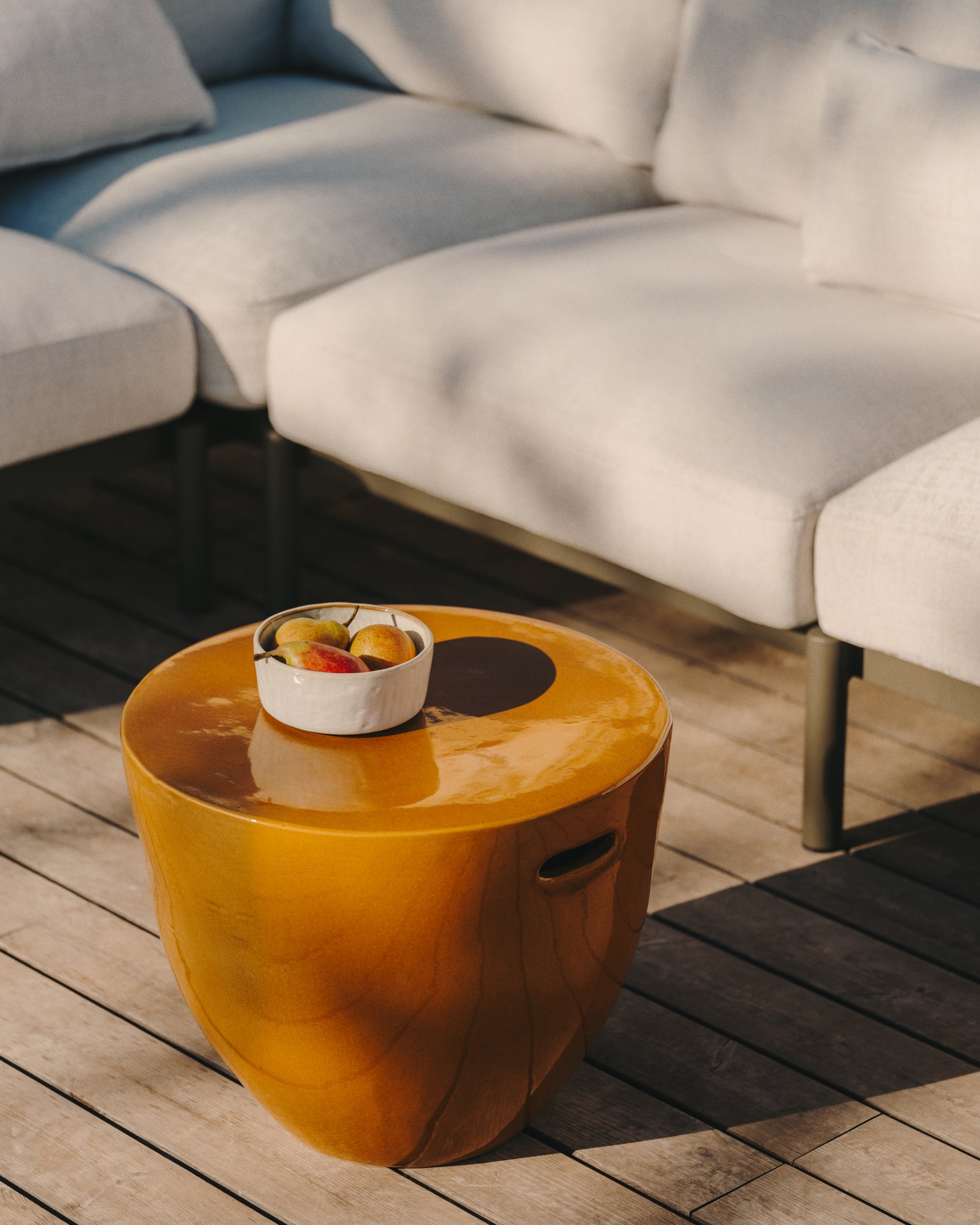 Mesquida outdoor side table made of ceramic with glazed mustard finish Ø 45 cm - Lifestyle