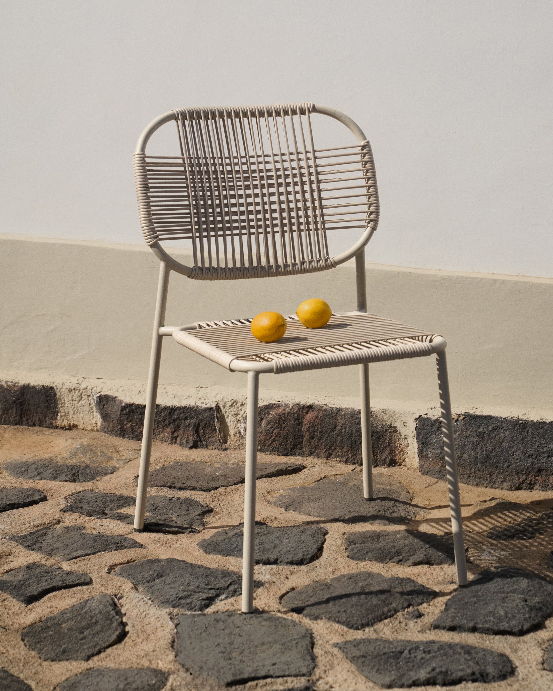 Talaier stackable outdoor chair  made of synthetic rope and galvanized steel in beige finish - Lifestyle