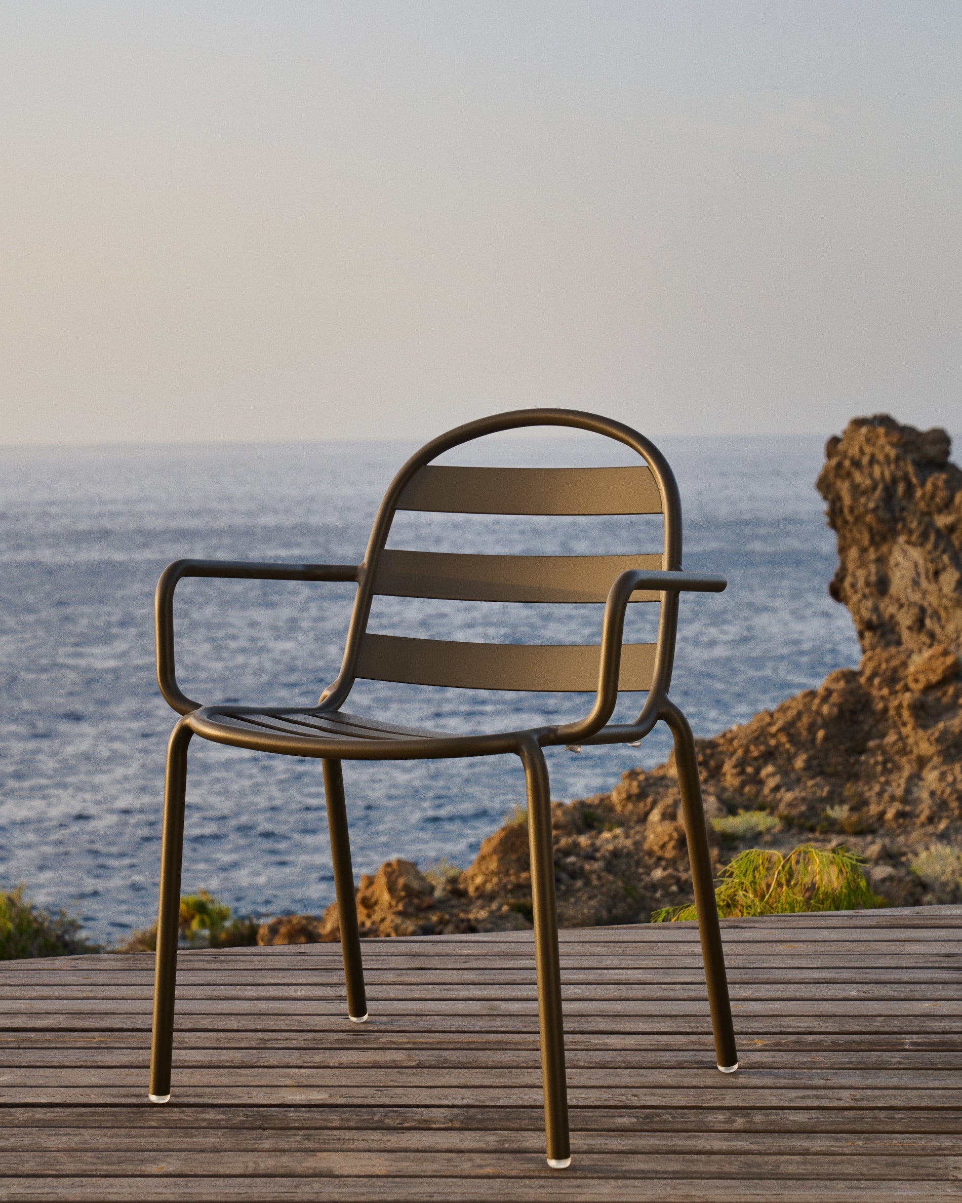 Joncols stackable outdoor aluminium chair with a powder coated grey finish - Lifestyle