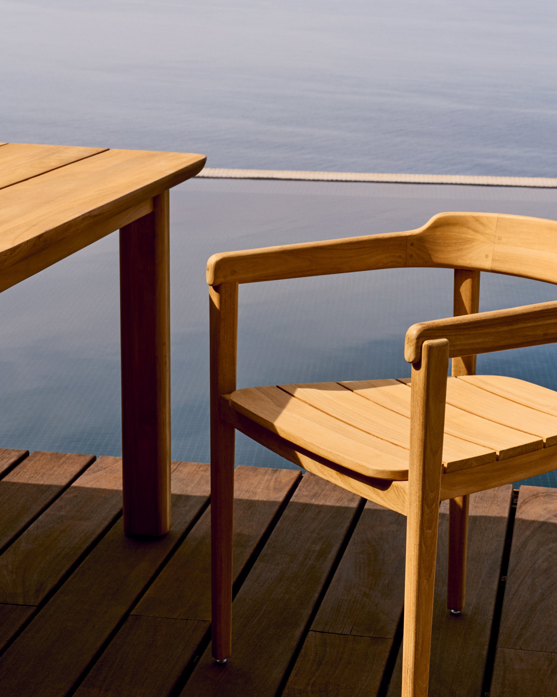 Icaro stackable solid teak wood chair in a natural finish, FSC 100% - Lifestyle