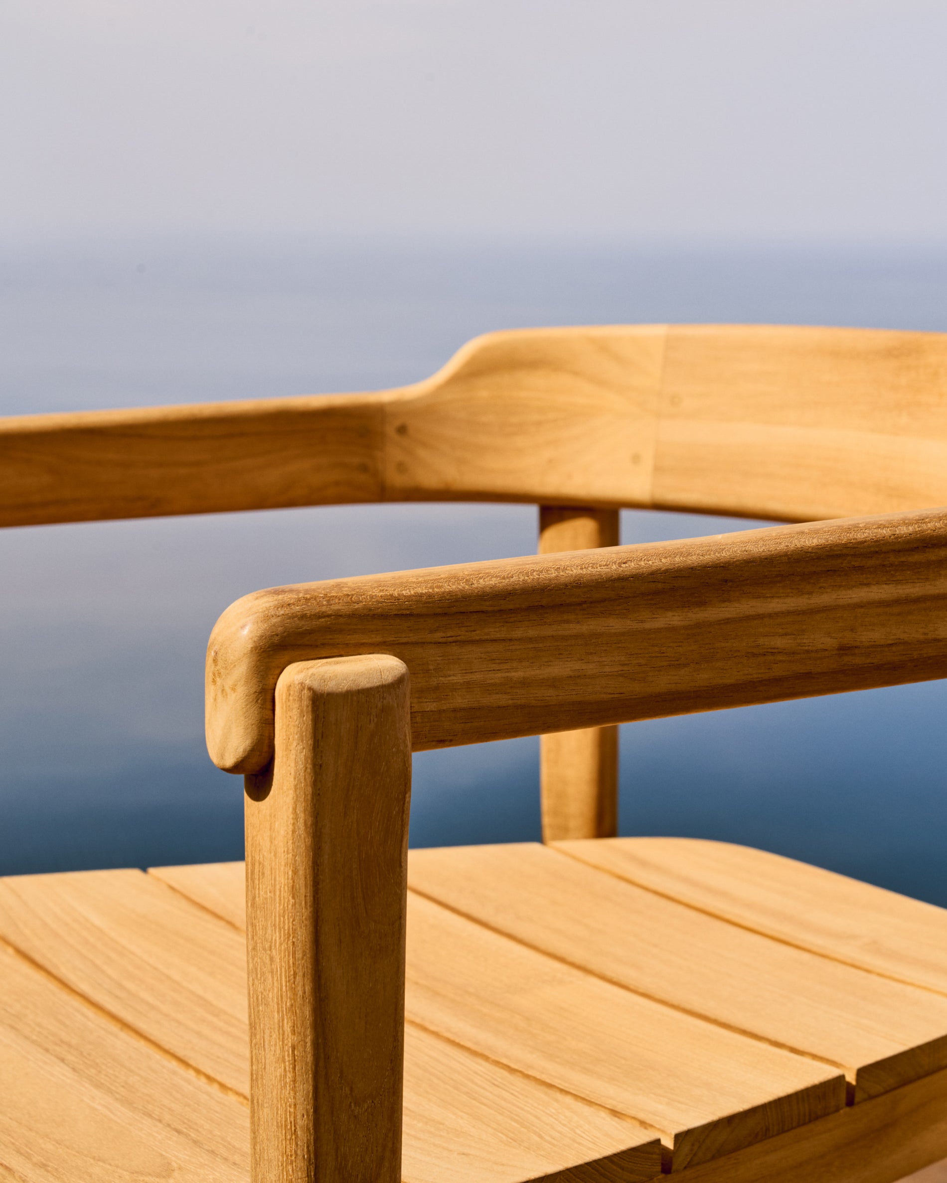 Icaro stackable solid teak wood chair in a natural finish, FSC 100% - Lifestyle