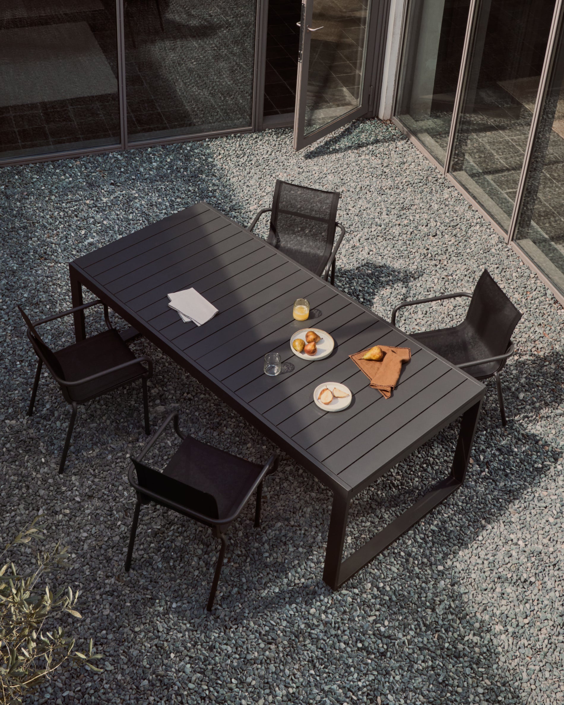 Galdana stackable outdoor chair made of aluminum with a dark grey painted finish - Lifestyle