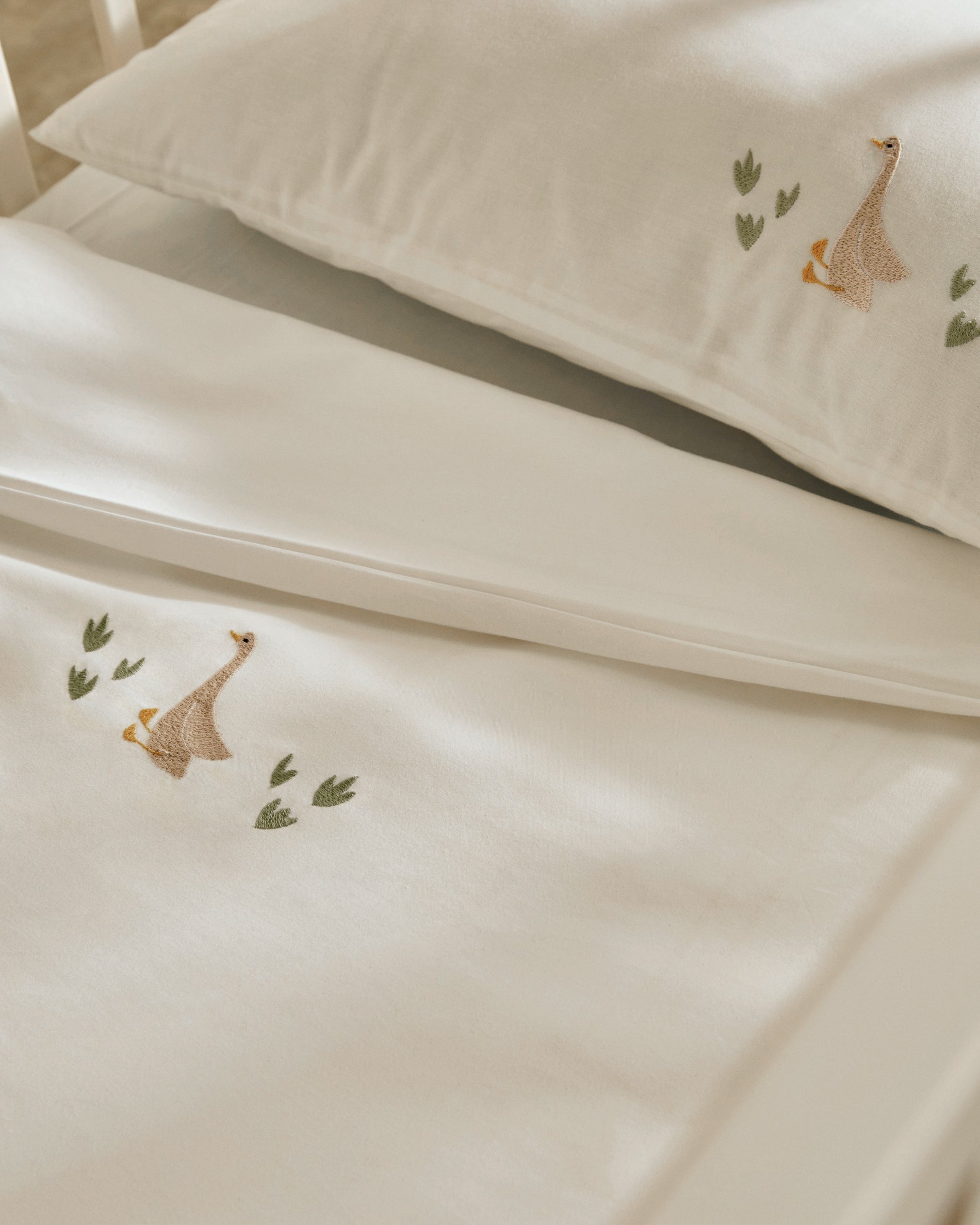 Milu set of duvet cover and pillow cases with embroidered goose for convertible cot and bed 70 x 140 cm - Lifestyle