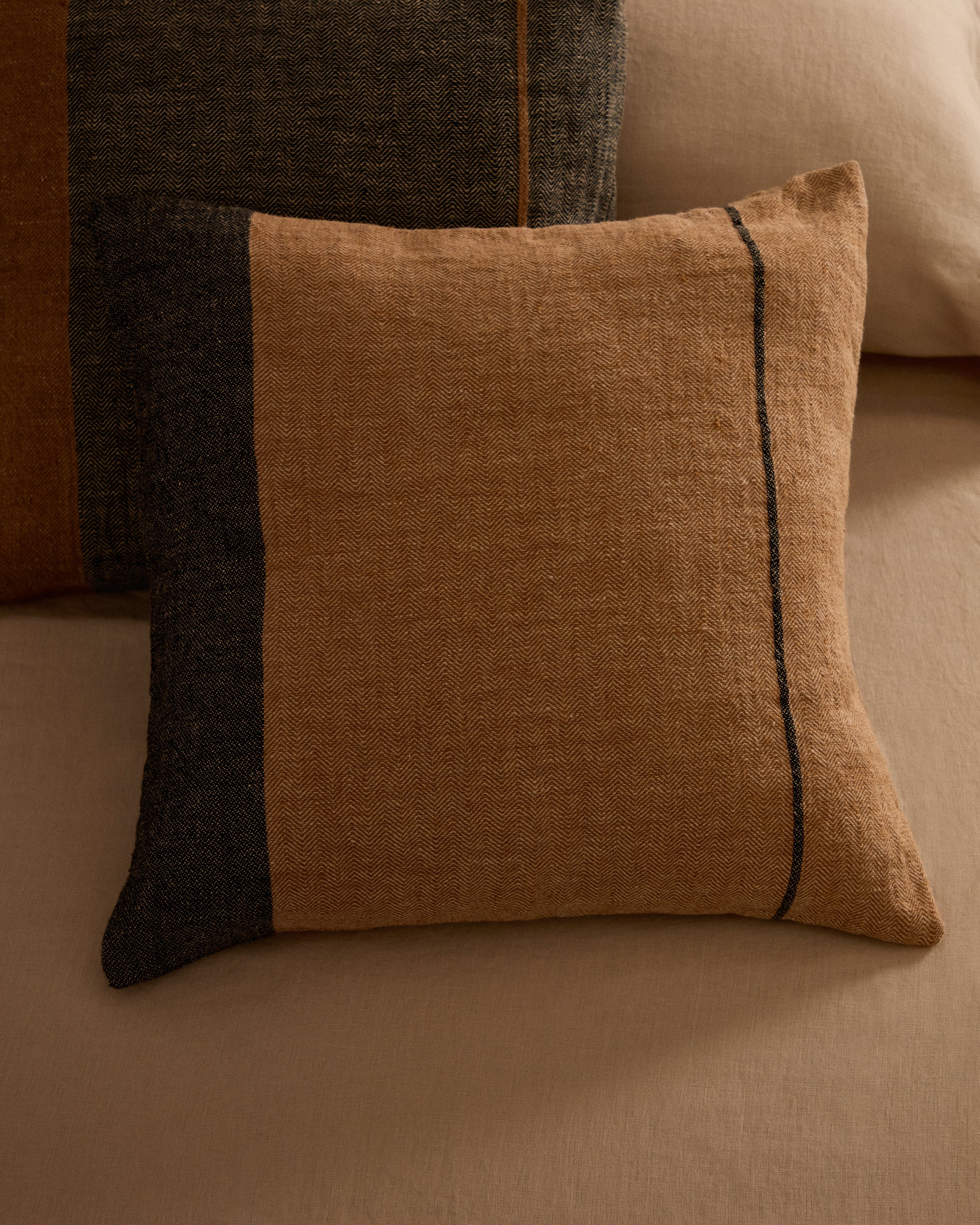 Eiko 100% terracotta linen cushion cover with vertical grey stripes, 50 x 50 cm - Lifestyle