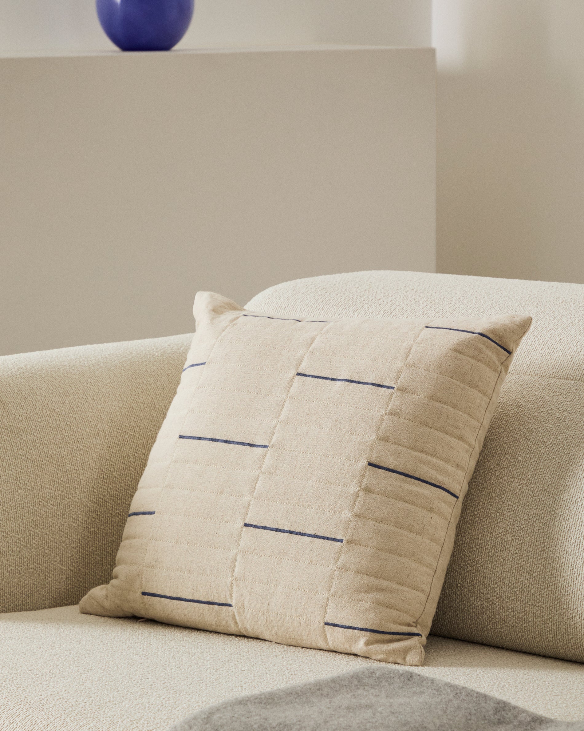 Blaina cushion cover in white linen with a blue embroidery feature, 45 x 45 cm - Lifestyle