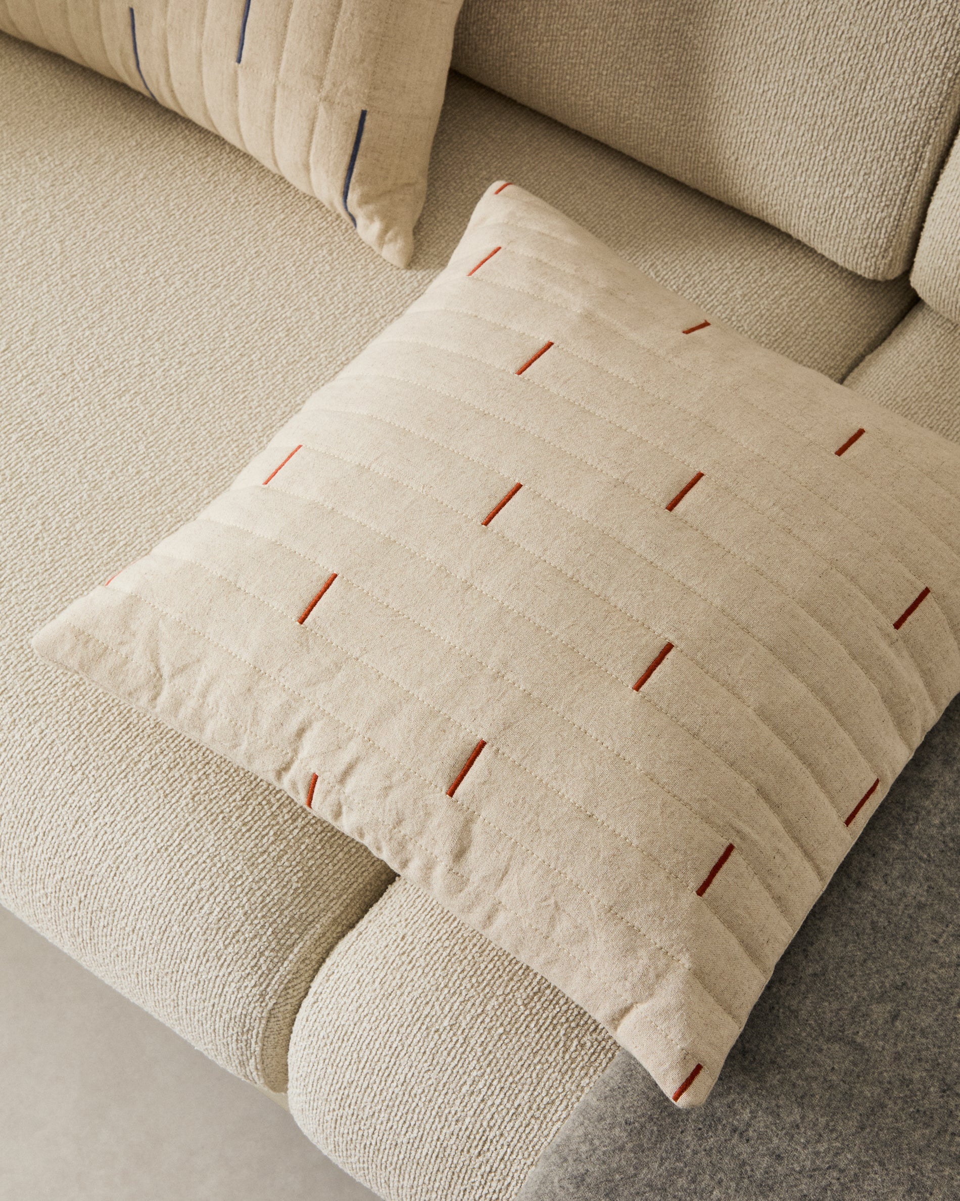 Blaina cushion cover in white linen with a red embroidery feature, 45 x 45 cm - Lifestyle