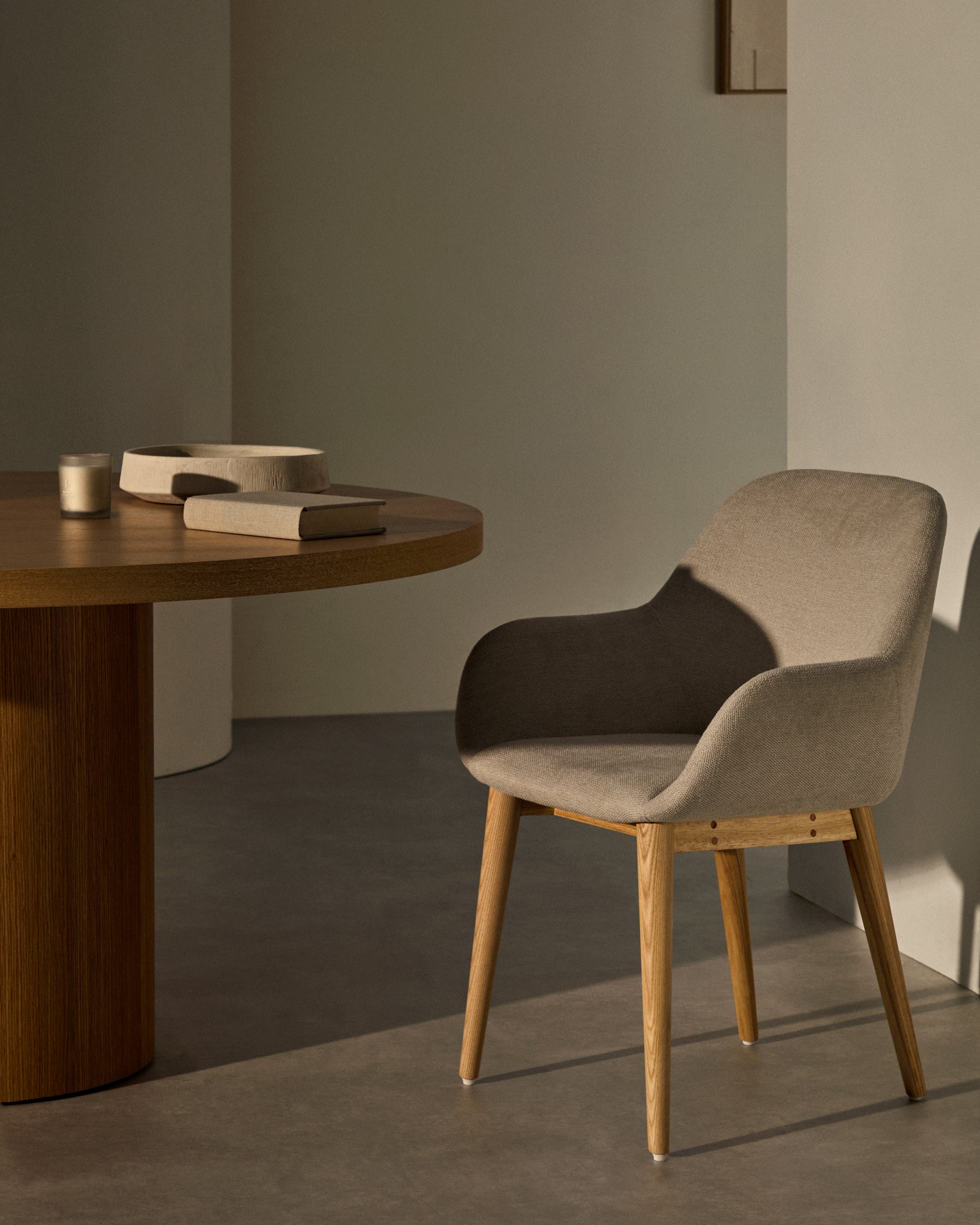 Konna chair in beige with solid ash wood legs in a natural finish - Lifestyle