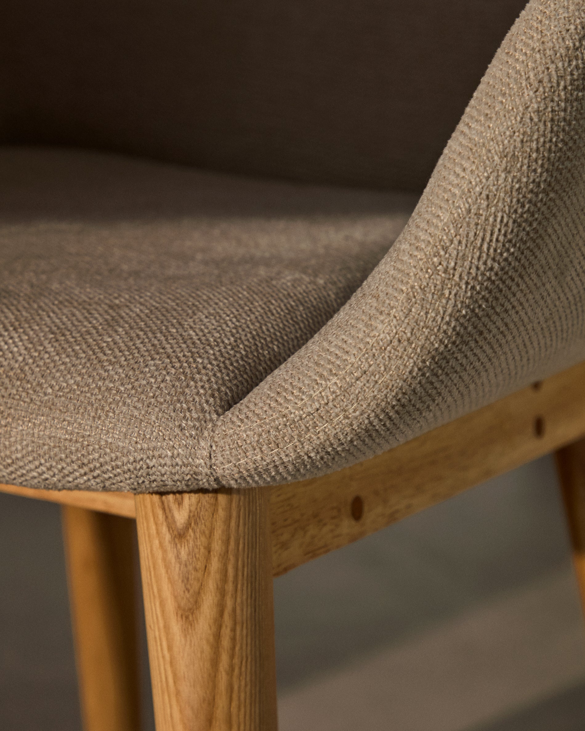 Konna chair in beige with solid ash wood legs in a natural finish - Lifestyle