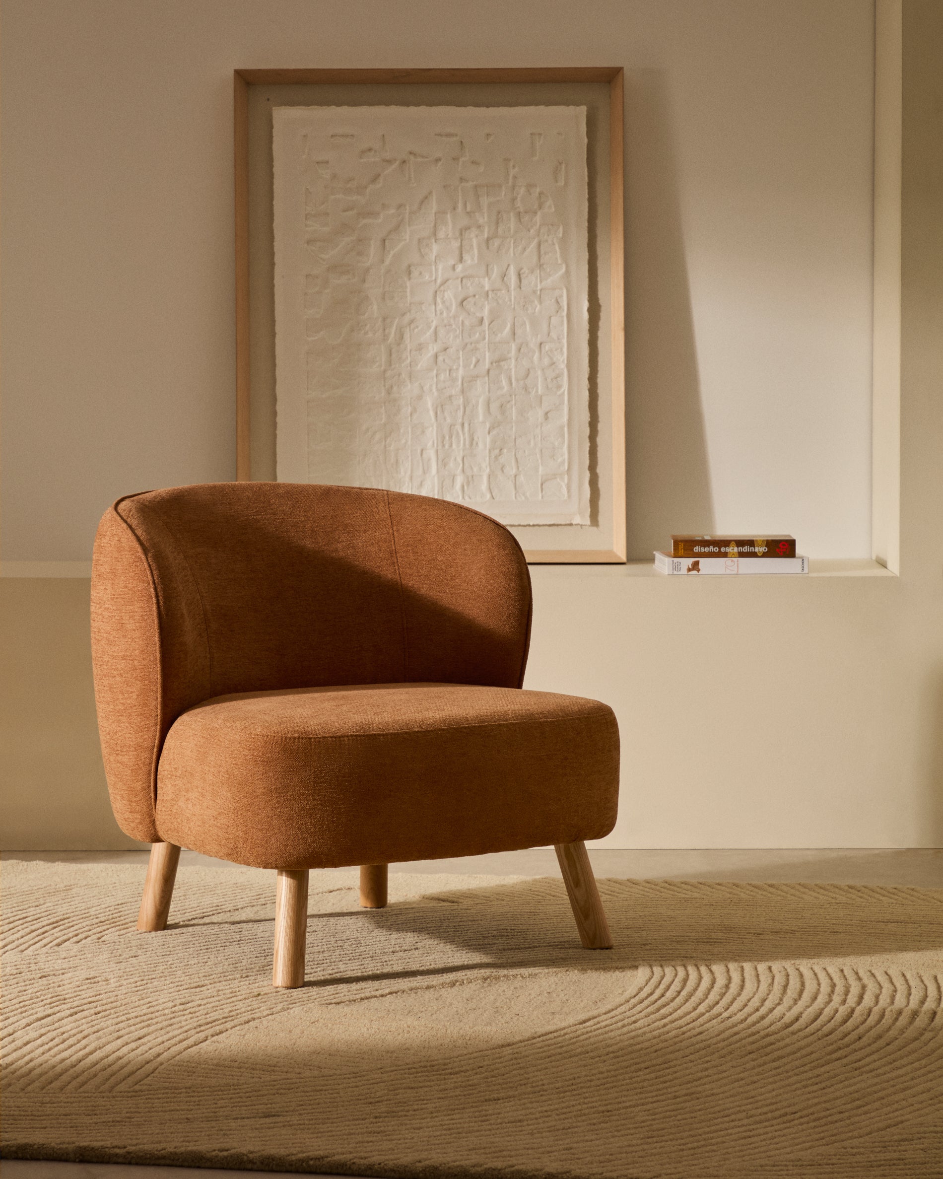 Ulit armchair in terracotta chenille with solid beech wood legs in a natural finish - Lifestyle
