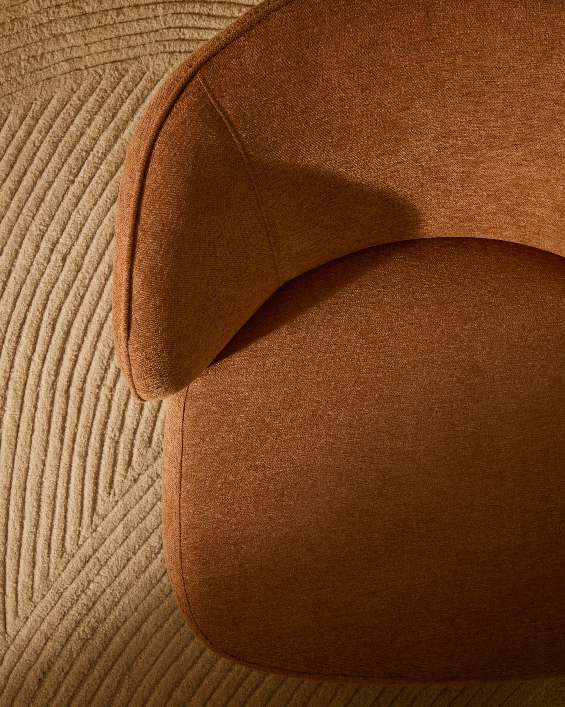 Ulit armchair in terracotta chenille with solid beech wood legs in a natural finish - Lifestyle