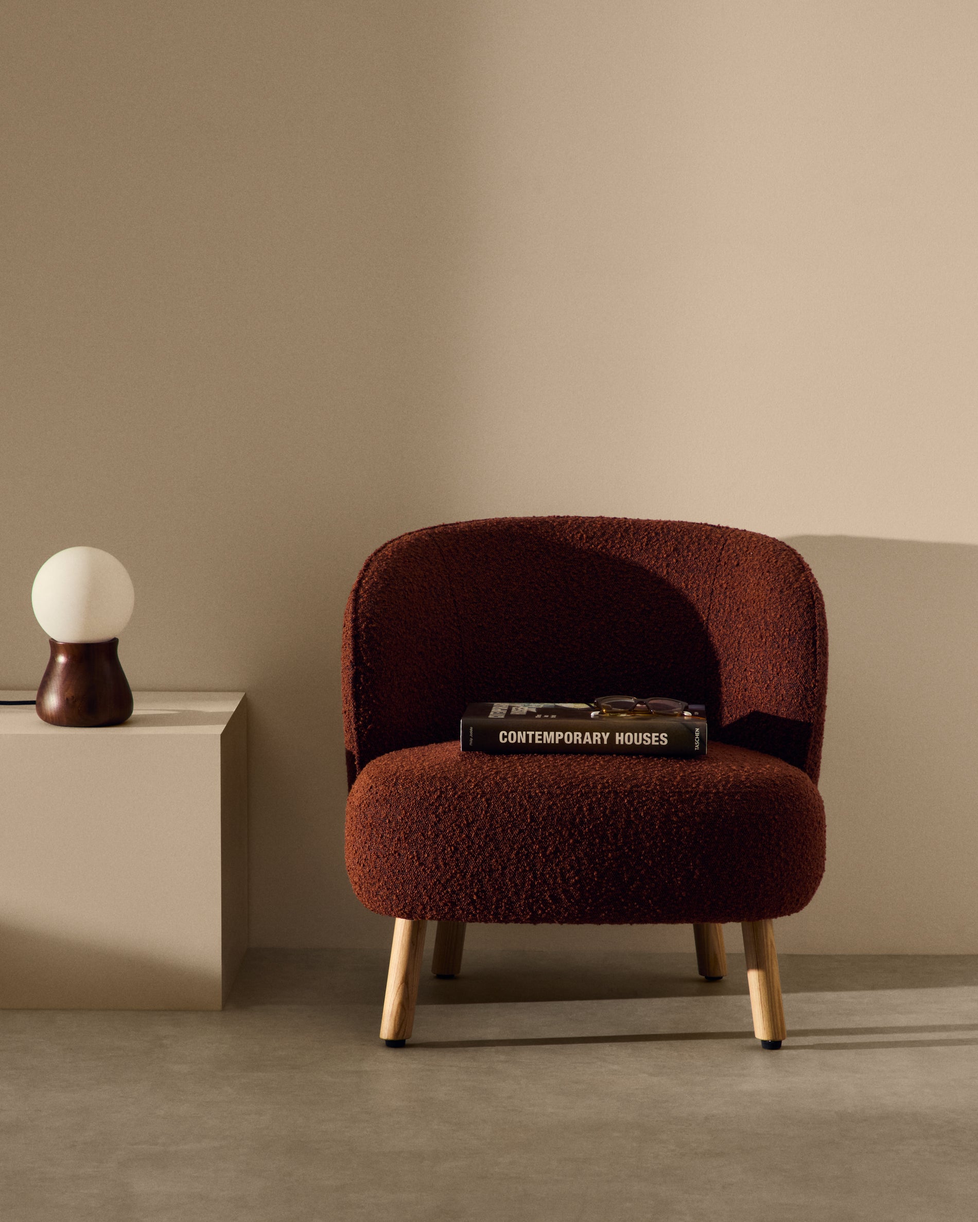Ulit armchair in terracotta bouclé with solid beech wood legs in a natural finish - Lifestyle
