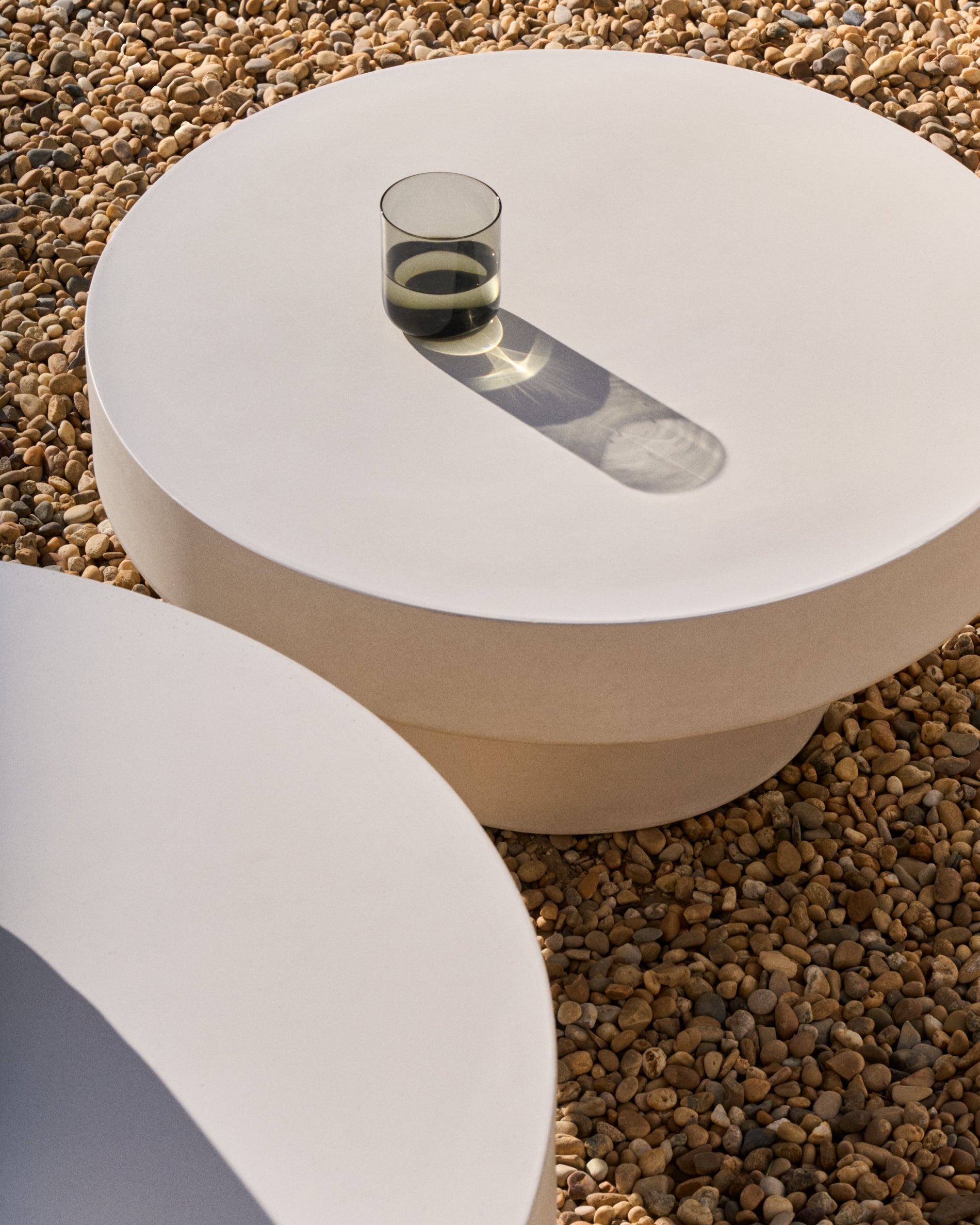 Aiguablava round coffee table in white cement, Ø 66 cm - Lifestyle